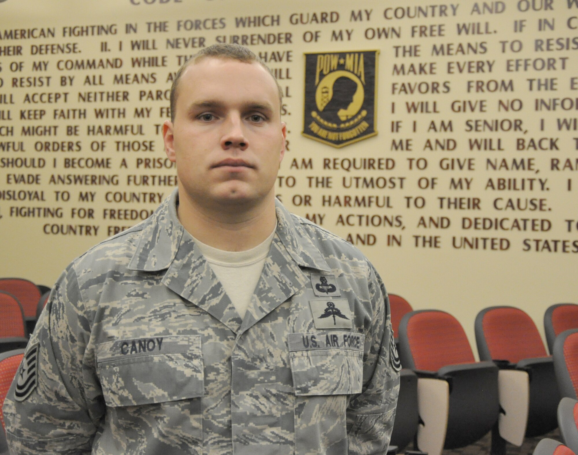 Tech. Sgt. Matthew Canoy, Special Tactics Training Squadron Personnel Recovery and Survival, Evasion, Resistance and Escape Operations and Training flight chief, poses in front of the Code of the U.S. Fighting Force display at the Special Tactics Training Squadron at Hurlburt Field, Fla., Jan. 27, 2011. Sergeant Canoy was selected for this week's Tip of the Spear spotlight. (DoD photo by U.S. Air Force Senior Airman Joe McFadden / RELEASED)