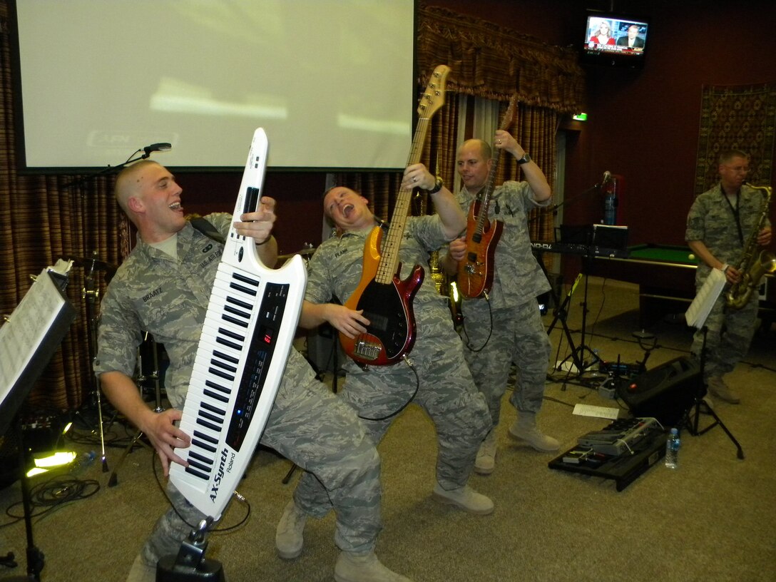 Piano player SrA Adam Braatz get guitar envy and breaks out the Keytar in a performance for deployed troops.