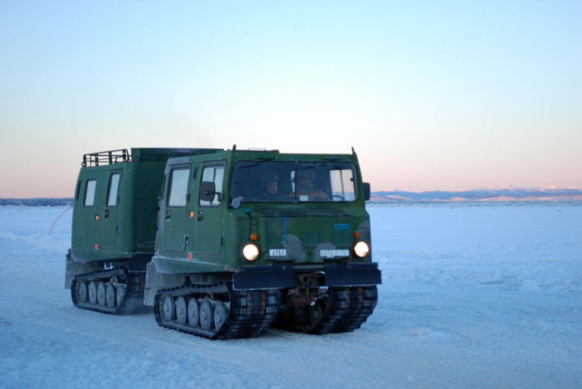 6th Engineer Battalion Soldiers drive a Small Unit Support Vehicle across an ice bridge at the Cold Regions Test Center at Fort Greely, Jan. 12. (U.S. Army photo/Sgt. Trish Mcmurphy)