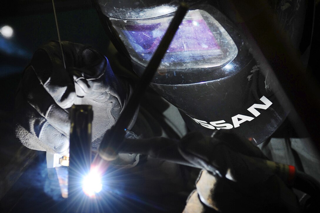 Airman 1st Class Webb Travis uses tungsten inert gas to weld a panel for a bomb loader during repairs Jan. 26, 2011, at Ellsworth Air Force Base, S.D. Tungsten inert-gas welding is a precise form of welding that can be performed on a variety of metals. Airman Travis is an aircraft metals technology technician assigned to the 28th Maintenance Squadron. (U.S. Air Force photo/Senior Airman Kasey Close)