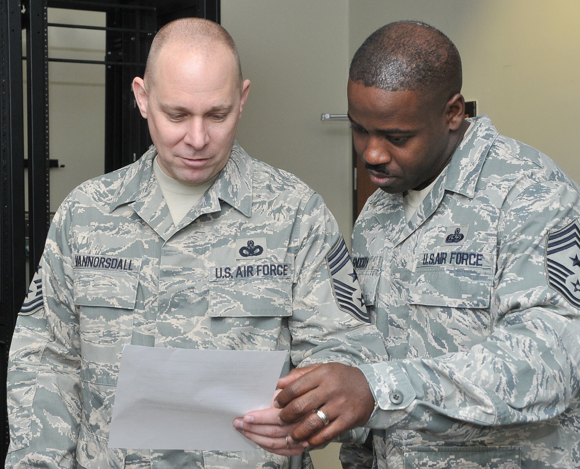 Chief Master Sgt. Dennis Vannorsdall, the 3 rd Air Force command chief, reads over his script with Chief Master Sgt. Marcus Snoddy, the39th Air Base Wing command chief, prior to taping a commercial with Armed Forces Network-Incirlik, Jan. 25, at Incirlik Air Base, Turkey. Chief Vannorsdall advises the commander on matters influencing the health, welfare, morale and effective utilization of more than 24,000 assigned enlisted personnel. As the component numbered Air Force for U.S. European Command, 3rd Air Force supports the U.S. Air Forces in Europe and EUCOM commander, both at the operational and tactical level, directing all USAFE forces engaged in contingency and wartime operations in the EUCOM area of responsibility. (U.S. Air Force photo by Staff Sgt. Alexandre Montes)