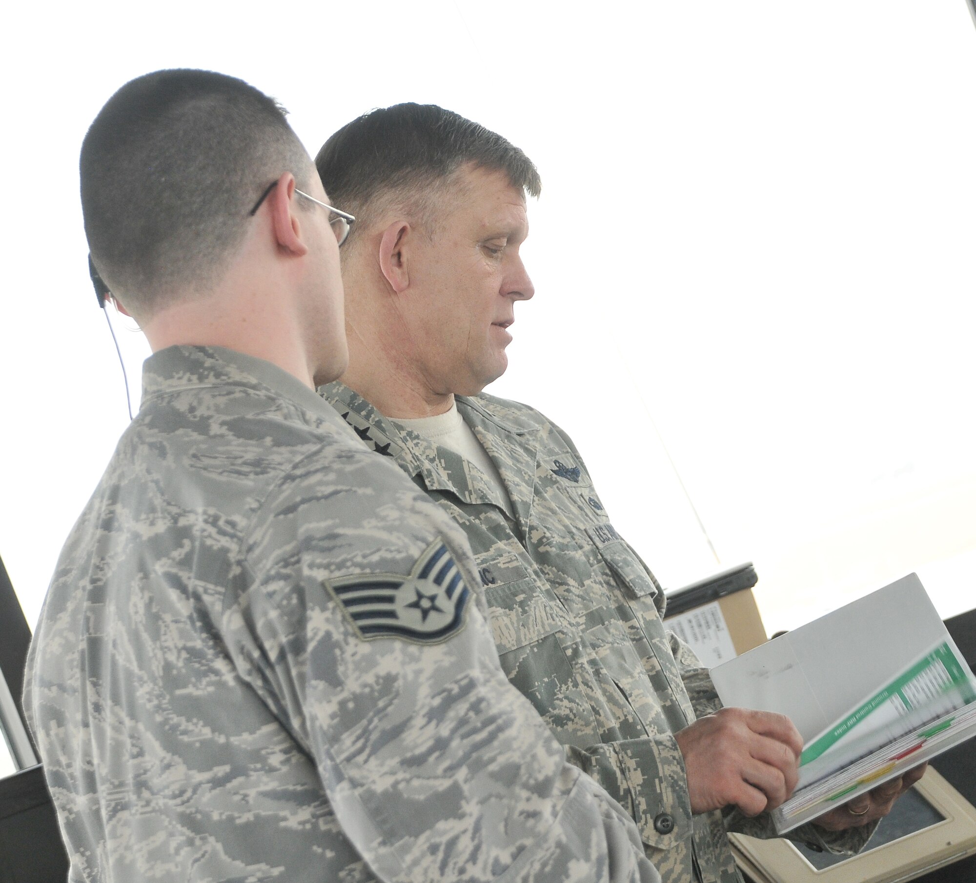 Lt. Gen. Frank Gorenc, 3rd Air Force commander, receives an air traffic control briefing from Staff Sgt. Christopher Hake from the 39th Operations Squadron, Jan. 25, at Incirlik Air Base, Turkey. General Gorenc toured Incirlik and talked to Airmen about changes happening in the Air Force As the 3rd Air Force commander, the general is responsible for 10 wings throughout Europe.  In this role, he visits the wings to gain perspective on how each wing accomplishes its mission and interact with Airmen. (U.S. Air Force photo by Staff Sgt. Alexandre Montes/released)