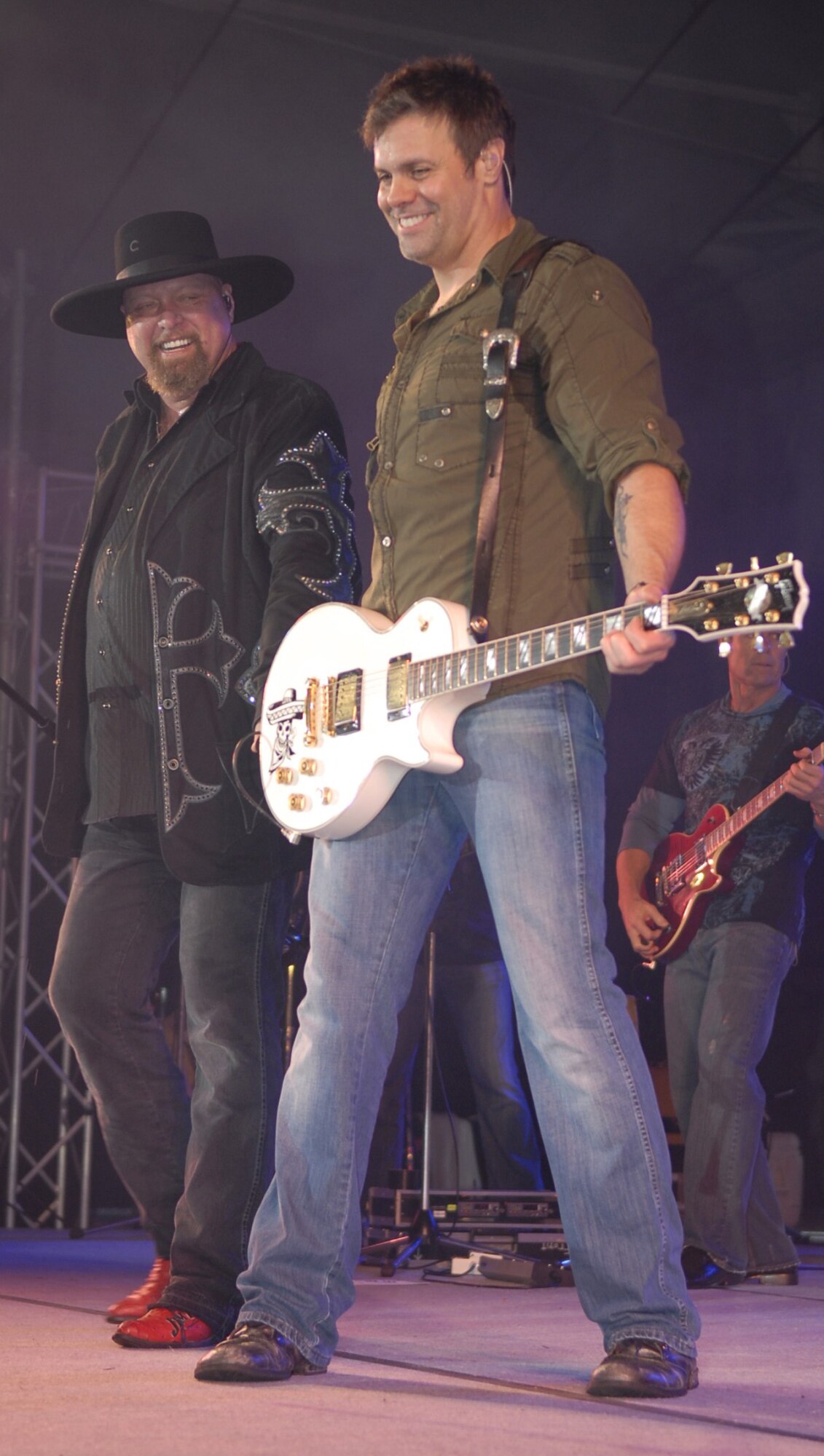 Country duo Montgomery Gentry play a concert for service members and their families on Kadena Air Base, Japan, Jan. 28, during the last of a four-stop USO tour. The duo also had two ‘meet and greets’ earlier in the day to give service members on Okinawa the chance to get a picture or autograph. (U.S. Air Force photo/ Airman 1st Class Tara A. Williamson)