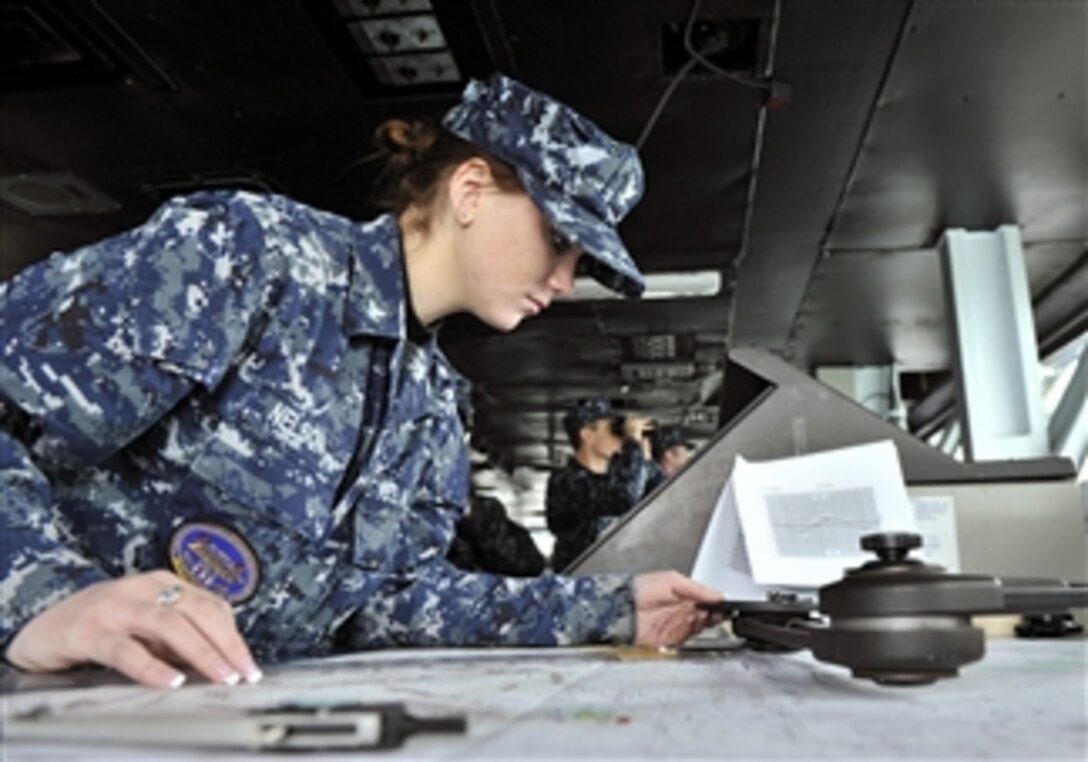 Petty Officer 3rd Class Sarah Nelson uses a parallel motion protractor to plot the position of the aircraft carrier USS Harry S. Truman (CVN 75) as the ship prepares to get underway on Jan. 27, 2011.  The Harry S. Truman is supporting fleet replacement squadron carrier qualifications.  