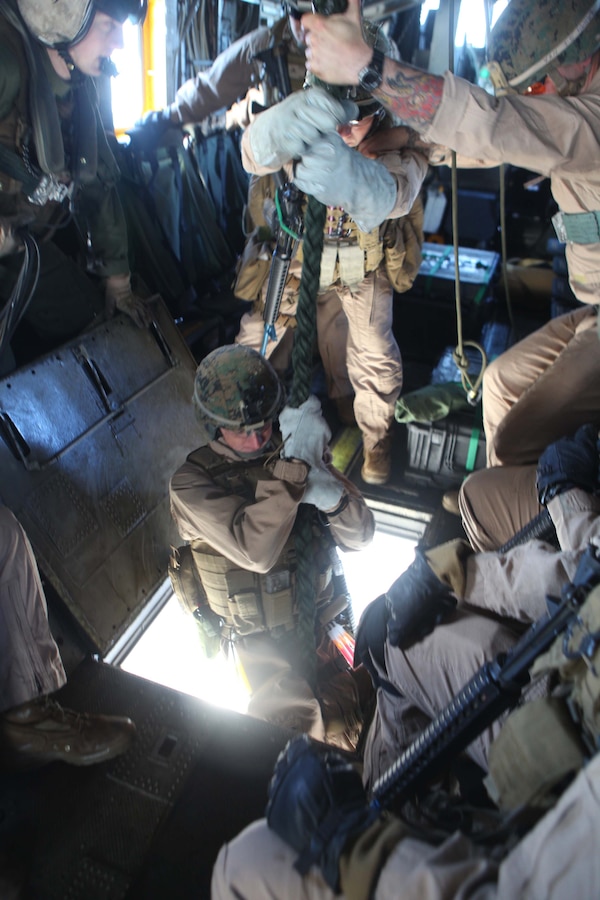 Marines and Sailors with the 24th Marine Expeditionary Unit’s Force Reconnaissance Platoon and Security Element, Headquarters and Service Company, Battalion Landing Team 1st Battalion, 2nd Marine Regiment fast rope from a CH-53E Super Stallion helicopter while conducting a simulated Visit, Board, Search and Seizure aboard the USNS Laramie, Jan. 31, 2012. The 24th MEU is conducting their Certification Exercise (CERTEX) with Iwo Jima Amphibious Ready Group scheduled Jan. 27 to Feb. 17, which includes a series of missions intended to evaluate and certify the unit for their upcoming deployment.  The CH-53E helicopters are a detachment from Marine Heavy Helicopter Squadron 464 based at Marine Corps Air Station New River, N.C., and comprise part of Marine Medium Tiltrotor Squadron VMM-261 (Rein), which is the Aviation Combat Element for the 24th MEU.