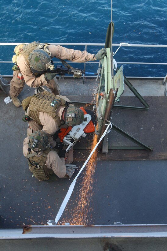 Marines and Sailors with the 24th Marine Expeditionary Unit’s Force Reconnaissance Platoon and Security Element, Headquarters and Service Company, Battalion Landing Team 1st Battalion, 2nd Marine Regiment, conduct a simulated Visit, Board, Search and Seizure aboard the USNS Laramie, Jan. 31, 2012. The 24th MEU is conducting their Certification Exercise (CERTEX) with Iwo Jima Amphibious Ready Group scheduled Jan. 27 to Feb. 17, which includes a series of missions intended to evaluate and certify the unit for their upcoming deployment.