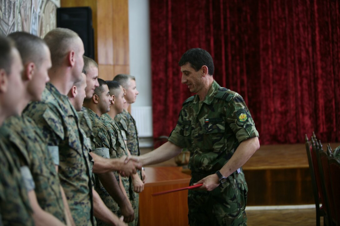 At the graduation and completion of the Bulgarian non-commissioned officer development course, a Bulgarian NCO instructor shakes hands with the Marines from Black Sea Rotational Force 11 that have not only displayed their military professionalism but also their ability to be personable and friendly.  A dedicated team of eight Marines from the rank of corporal to first sergeant made the NCO Development detachment that conducted courses to advise and build the leadership ability and responsibility of partner nations’ NCO Corps. The Marines have been traveling around the Black Sea, Balkan and Caucasus regions of Eastern Europe since April providing the NCO development course to the participating countries who have requested it. They have conducted NCO-development training with Romania, Serbia, Azerbaijan and Bulgaria with future stops in Georgia, Ukraine, Bosnia and Macedonia.