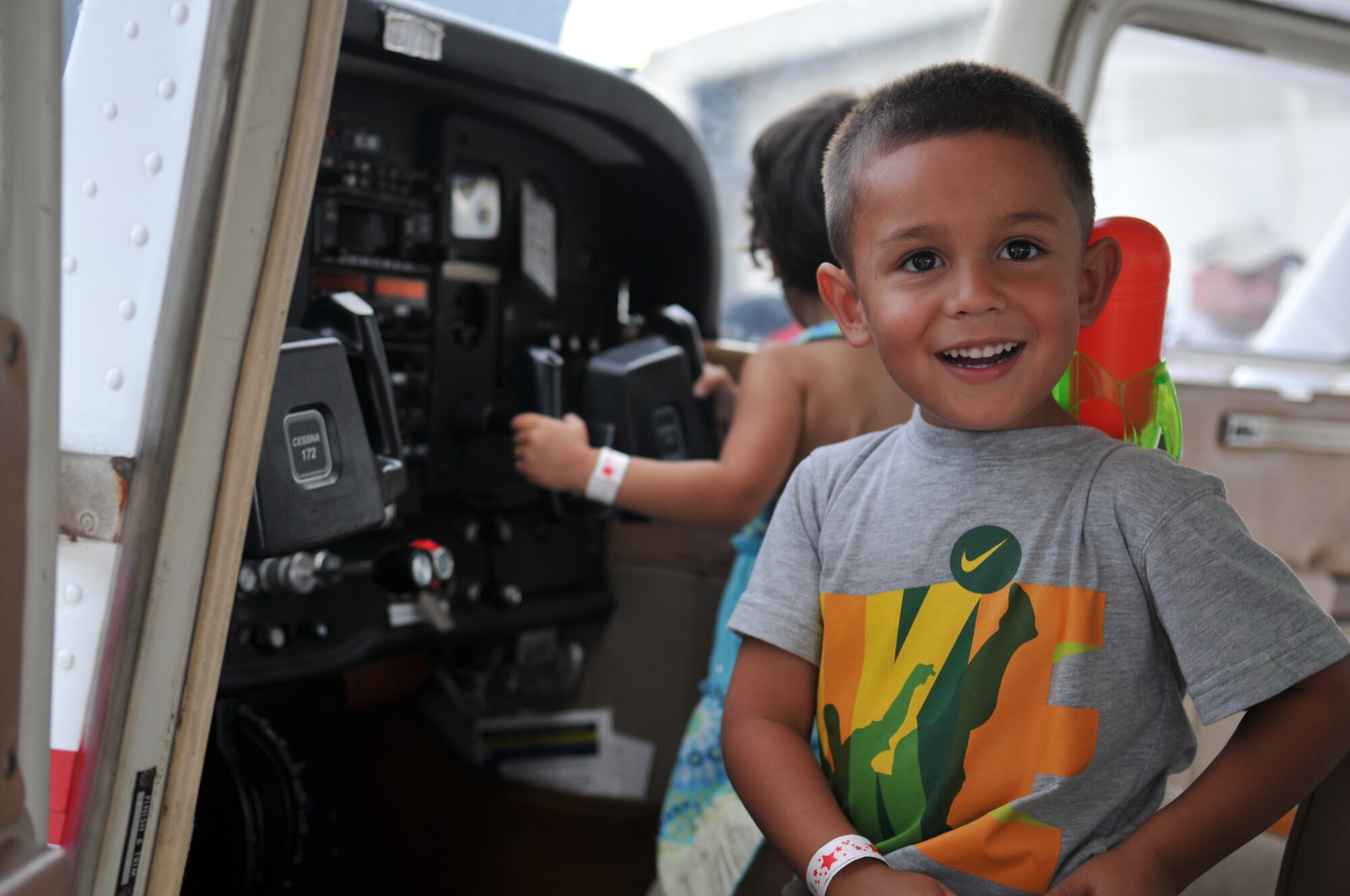 U.S. Army dependents Rufino Farias III and his sister Audrey check out a Cessna on display during AmericaFest 2011, July 1. AmericaFest takes place July 1 and 2, and is an event designed to build international relations with the local Okinawan community. (U.S. Air Force photo/Tech. Sgt. Angelique Perez)