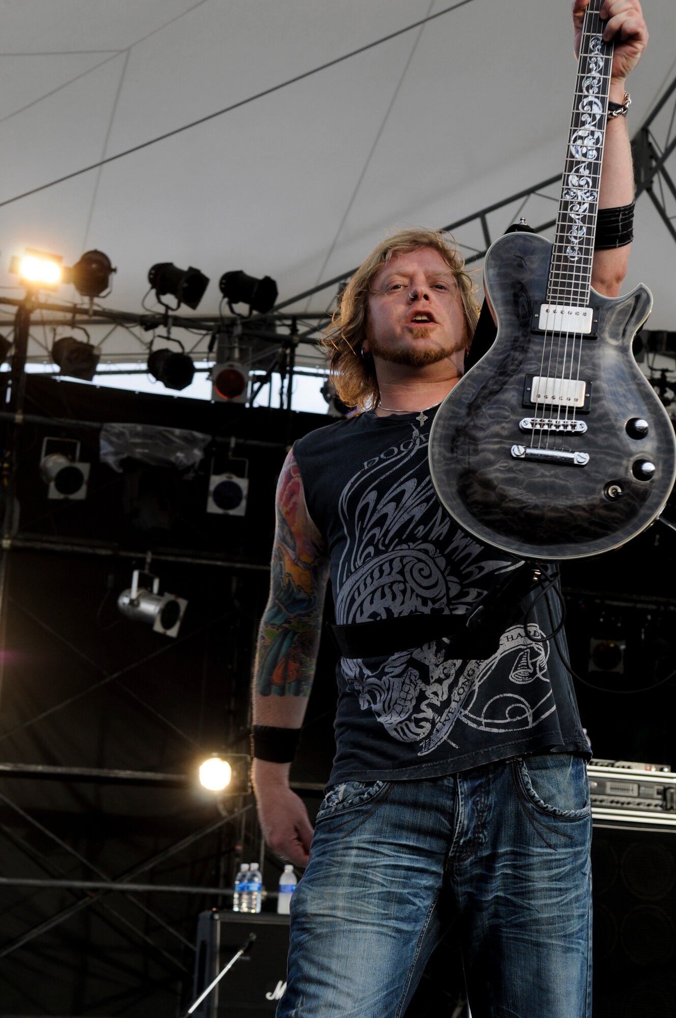A guitarist for the American rock band, 12 Stones,  lifts his guitar to the crowd during their performance at AmericaFest on Kadena Air Base, Japan, July 1. During the two-day Independence Day celebration, a variety of live entertainment performed for the crowd including 12 Stones and country-pop singer Jessie James. (U.S.Air Force photo/ Airman 1st Class Maeson L. Elleman)