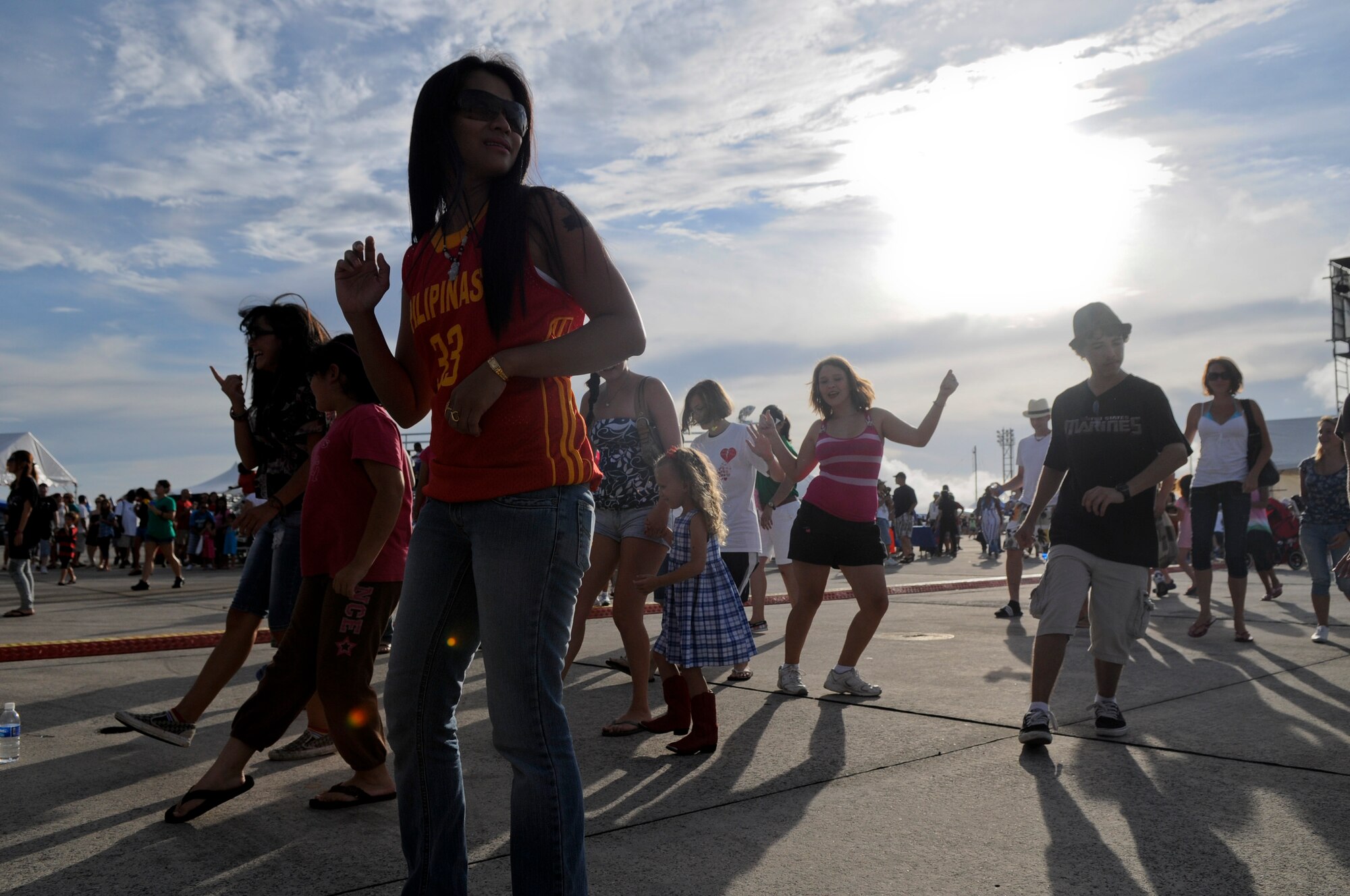 The crowd joins in during the “Electric Slide” at AmericaFest on Kadena AirBase, Japan, July 1. AmericaFest gave Status of Forces Agreement-status members as well as local Okinawans the chance to celebrate Independence Day in a carnival atmosphere with rides, games and live entertainment. (U.S. Air Forcephoto/ Airman 1st Class Maeson L. Elleman)