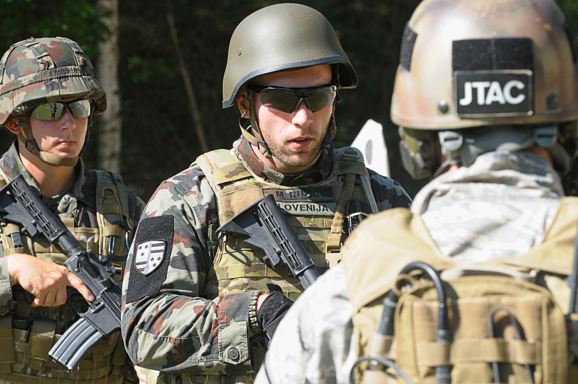 Slovenian Joint Terminal Attack Controllers listen to instructions during advanced weapons training at Allied Strike 2011 at Grafenwoehr Training Area, Germany, June 29, 2011. Allied Strike is Europe’s premier Close Air Support exercise, held annually to conduct robust, realistic CAS training that helps build partnership capacity among Allied NATO nations and refine the latest operational CAS tactics. (U.S. Air Force photo by Airman 1st Class Desiree W. Esposito)