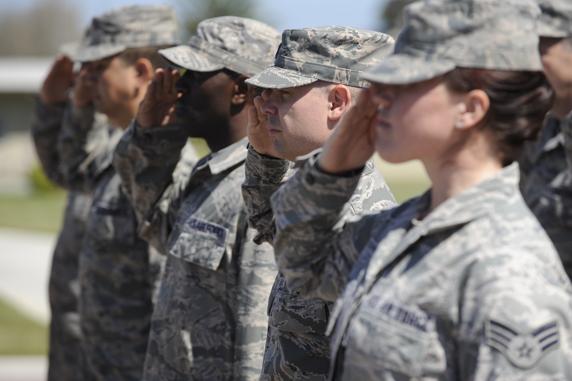 VANDENBERG AIR FORCE BASE, Calif. -- Members of the Wing Staff Agencies salute during a retreat ceremony at the headquarters building here Thursday, June 30, 2011. (U.S. Air Force photo/Staff Sgt. Andrew Satran) 
