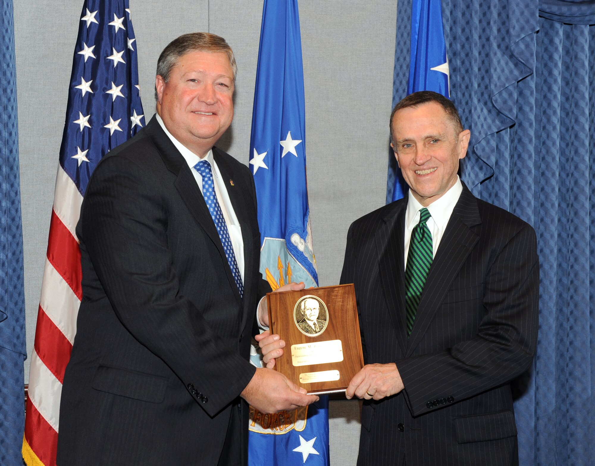 Secretary of the Air Force Michael Donley presents the 2010 Eugene M. Zuckert Management Award to Charles Henderson during a ceremony in the Pentagon, June 29, 2011. (U.S. Air Force Photo/Andy Morataya)