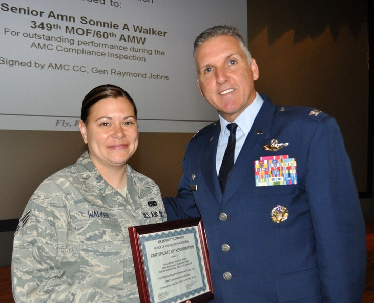TRAVIS AIR FORCE BASE, Calif. -- Senior Amn. Sonnie A. Walker, 349th Maintenance Operations Flight, was singled out for special recognition at the June 25, 2011, Commanders Call. (U.S. Air Force photo/Senior Master Sgt. Ellen L. Hatfield)