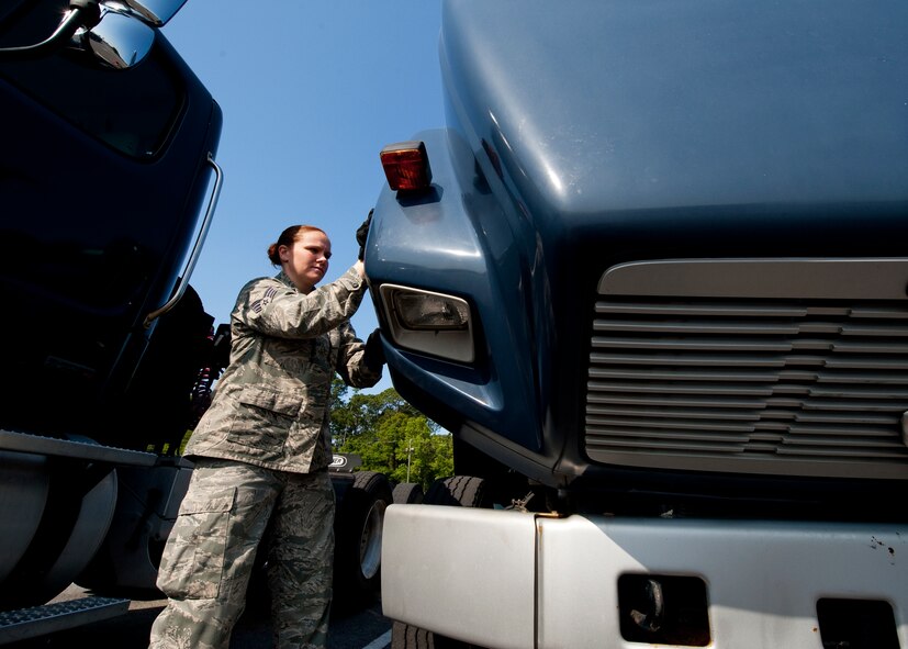 Senior Airman Jessica Spence, 96th Logistics Readiness Squadron vehicle operations, lifts the lid on one of Eglin’s military tractor trailer cabs for an inspection after it has been returned from use.  Mileage, damage, fluids and normal wear and tear are examined to ensure serviceability for the next mission.  The Airmen of vehicle operations are responsible for driving, upkeep, dispatching and delivery of more than 130 vehicles on base.   The vehicle operations flight managed more than 13 thousand transportation requests last year.  (U.S. Air Force photo/Samuel King Jr.)