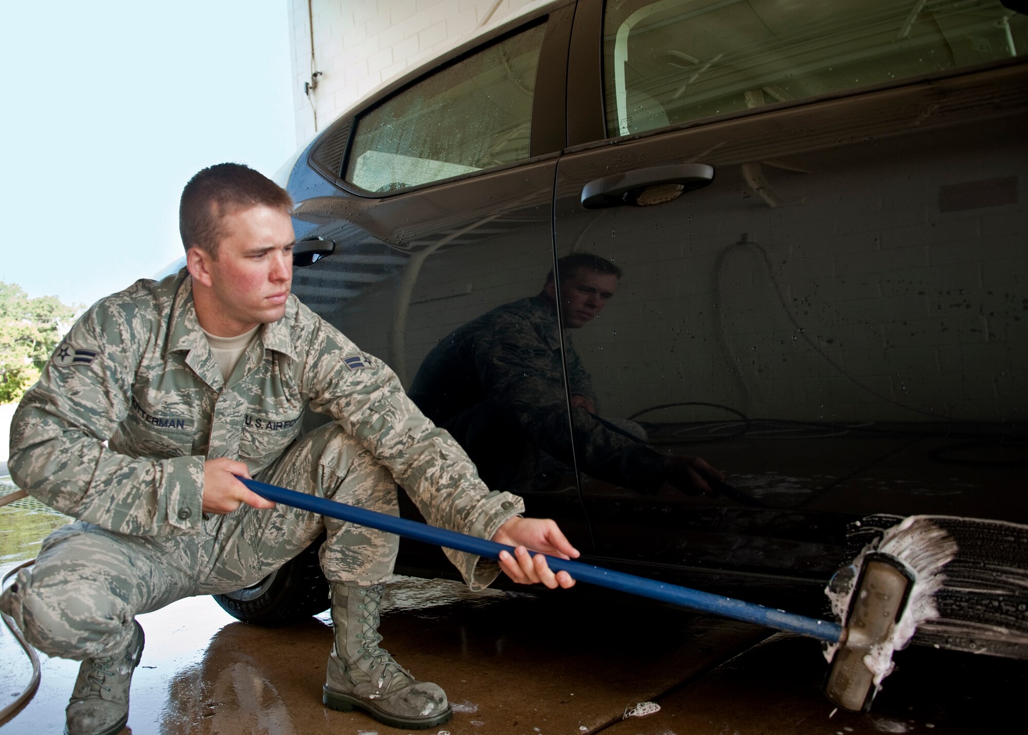 Airman 1st Class Kitterman, 96th Logistics Readiness Squadron vehicle operations, washes down a government-owned-vehicle before returning it to the lot.  Airmen in the vehicle operations flight ensure each vehicle is clean and serviceable for the next customer.  Vehicle operations is also responsible for driving, upkeep, dispatching and delivery of more than 130 vehicles on base.  The vehicle operations flight managed more than 13 thousand transportation requests last year.  (U.S. Air Force photo/Samuel King Jr.)