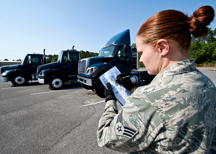 Senior Airman Jessica Spence, 96th Logistics Readiness Squadron vehicle operations, goes over the checklist for a military tractor trailer cab after it has been returned from use.  Mileage, damage, fluids and normal wear and tear are examined to ensure serviceability for the next mission.  The Airmen of vehicle operations are responsible for driving, upkeep, dispatching and delivery of more than 130 vehicles on base.   The vehicle operations flight managed more than 13,000 transportation requests last year.  (U.S. Air Force photo/Samuel King Jr.) 