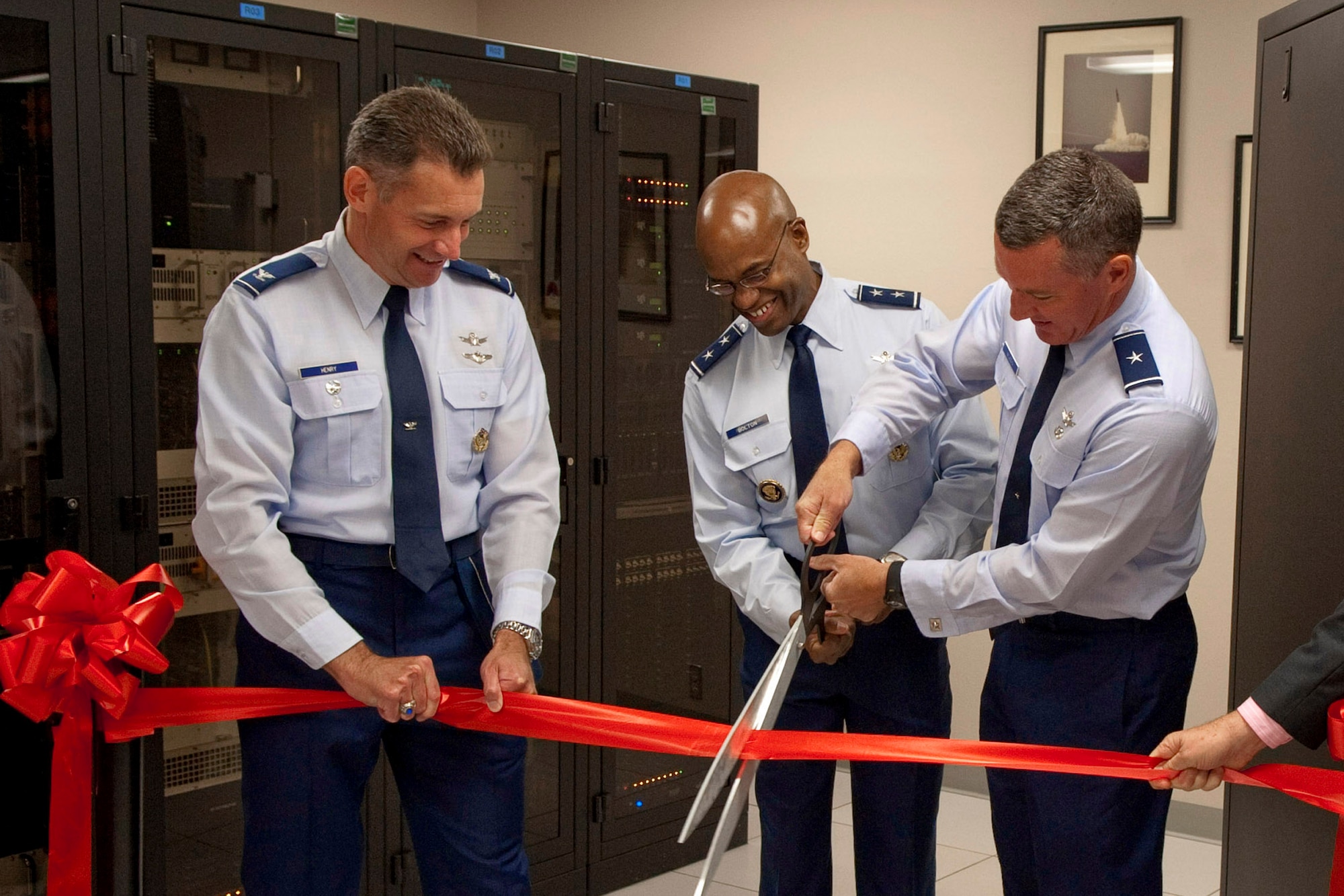 Maj. Gen. Edward Bolton Jr., Air Force Director of Space and Cyber Operations, and Brig. Gen. Ed Wilson, 45th Space Wing Commander, cut the ribbon for the new Radar Open Systems Architecture 0.134 radar, south of The Tides, with Col. Gary Henry, Launch
and Range Systems Wing Commander, Space and Missile Systems Center. The first ROSA radar to be delivered to the Eastern or Western Range, it features a new transmitter and antenna feed, radar imaging capabilities, and quadruple the output power of its replaced legacy system. ROSA is part of a major modernization program to reduce costs of operations, maintenance and support, increase reliability, and shorten mission  turnaround.