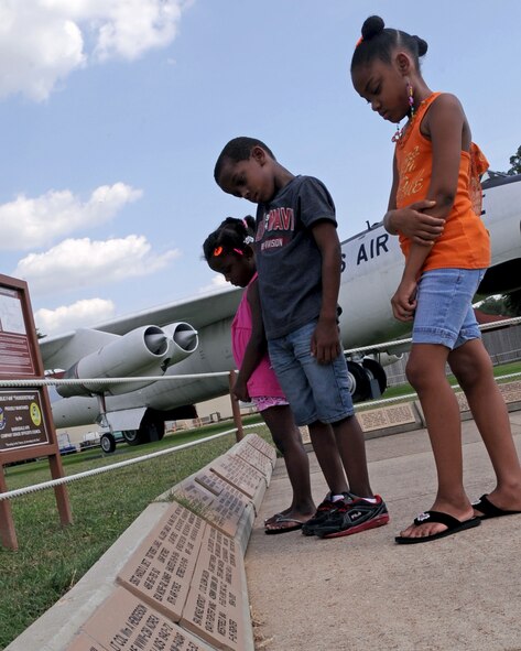 Brother and sisters, Tiara, 9, Roman Jr., 7, and Camille Proctor, 4, observe the Mall of Memories along the pathway of the Eighth Air Force Museum Airpark on Barksdale Air Force Base, La., June 29. The airpark is only half of what the museum has to offer, more history of aerial bombardment is inside, including events prior to WW II. The museum is open from 9:30 a.m. to 4 p.m. daily. (U.S. Air Force Photo/Senior Airman La'Shanette V. Garrett)(RELEASED) 