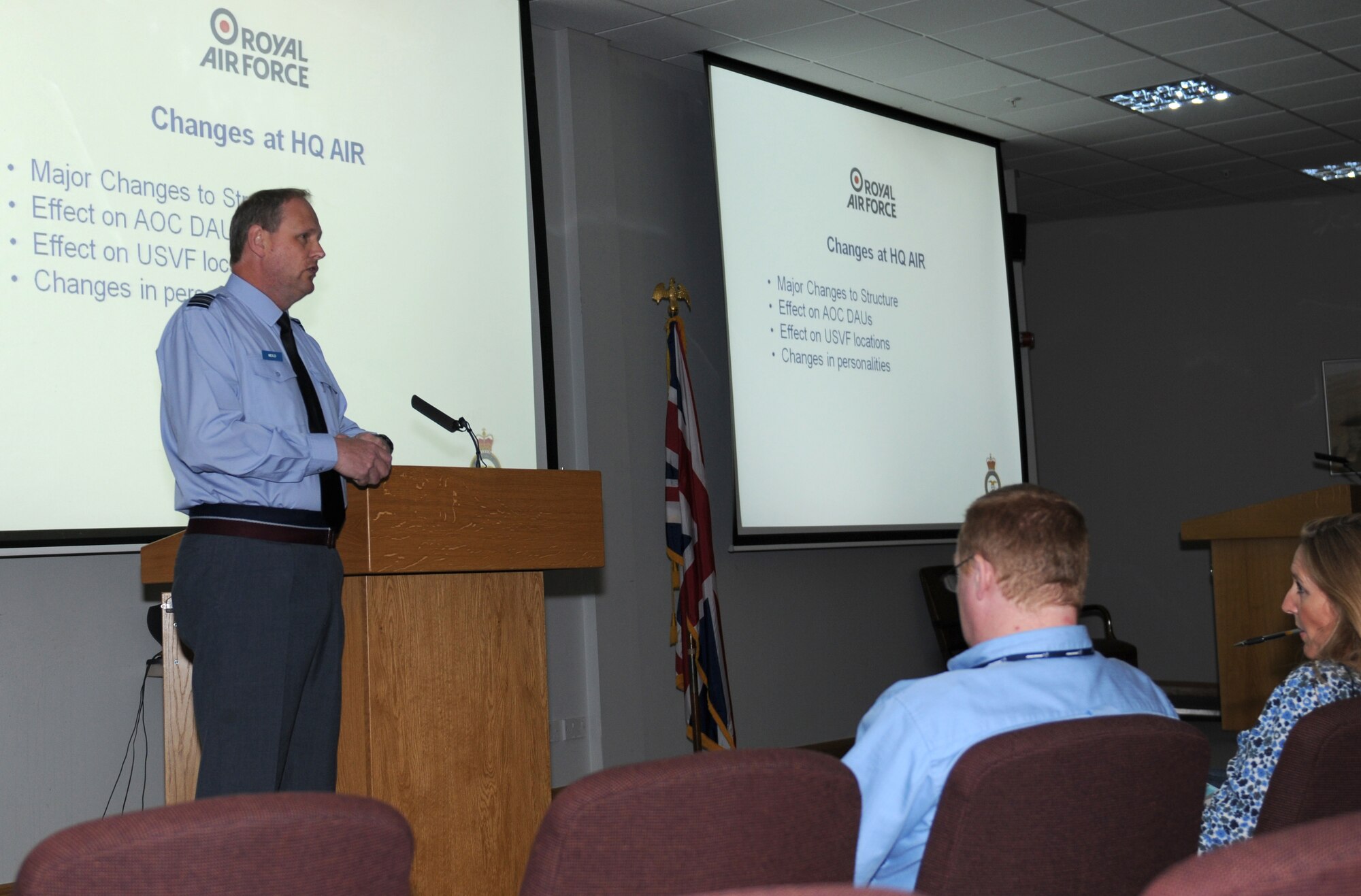 ROYAL AIR FORCE LAKENHEATH, England - RAF Squadron Leader Jeremy Neild, RAF Lakenheath RAF commander, speaks at a Commander's Call in the Strike Eagle Complex on June 28, 2011. Squadron Leader Neild spoke to Ministry of Defense personnel about issues on base as well as MOD-wide changes. (U.S. Air Force photo/Airman Cory Payne)