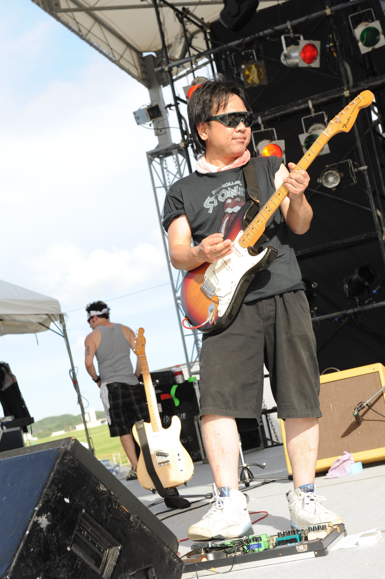 The base player for the local group, Storm Watch, rocks out during the bands performance at Kadena’s AmericaFest on Kadena Air Base, Japan, July 1. AmericaFest is a chance to celebrate Independence Day and share the celebration with our Japanese counterparts. Food, games and musical entertainment were also provided. (U.S. Air Force photo/Airman 1st Class Brooke P. Beers)