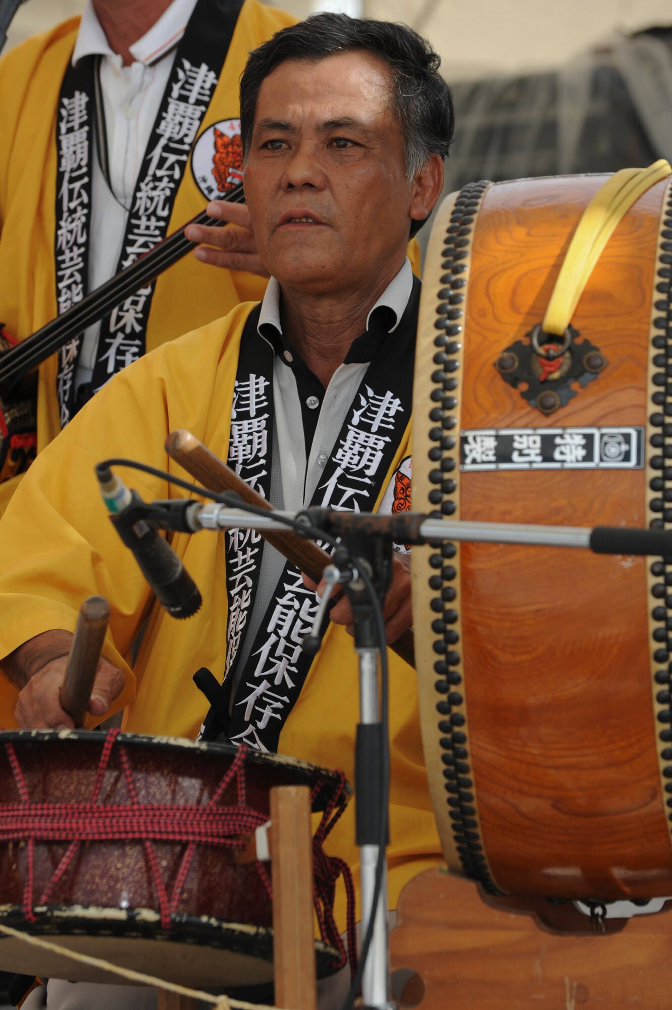 A drummer from the performance group Shi-Shi  dogs, performs the musical aspect of a local dance routine during Kadena’s AmericaFest, Kadena Air Base, Japan, July 1. AmericaFest is a two day event to celebrate not only the fourth of July but to share the celebration with our local Japanese counterparts.  The rock group 12-Stones and country-pop singer Jessie James came  from America to perform for the event along with other local bands and performance groups. (U.S. Air Force photo/Airman 1st Class Brooke P. Beers)