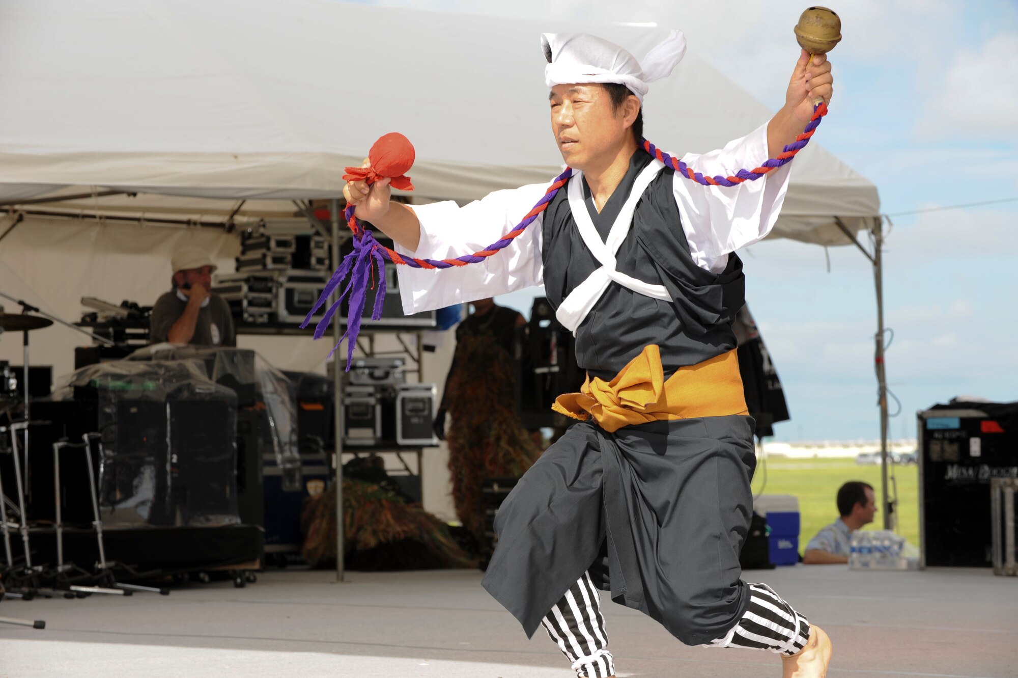 A member of the performance group Shi-Shi dogs performs historical Okinawan dance during Kadena’s America Fest, Kadena Air Base, Japan, July 1. AmericaFestis a chance to celebrate Independence Day and share the celebration with our Japanese counterparts Food,  games and musical entertainment were provided. (U.S. Air Force photo/Airman 1st Class Brooke P. Beers)