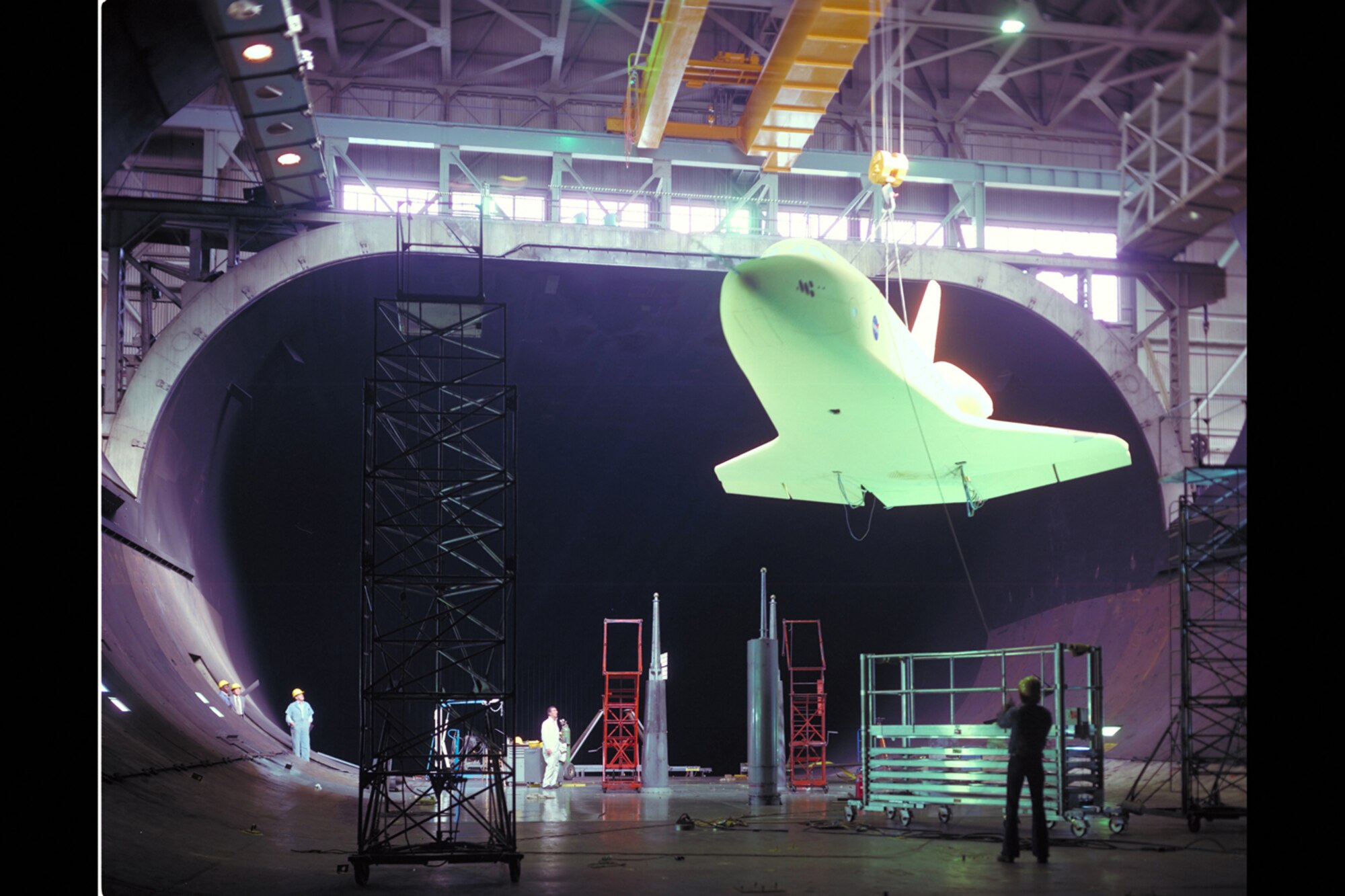 In 1975, scale model of the space shuttle orbiter is installed into the 40 by 80-foot wind tunnel at the NFAC for subsonic aerodynamic testing of what the vehicle would experience during the latter stages of re-entry. (NASA photo by Lee Jones) 