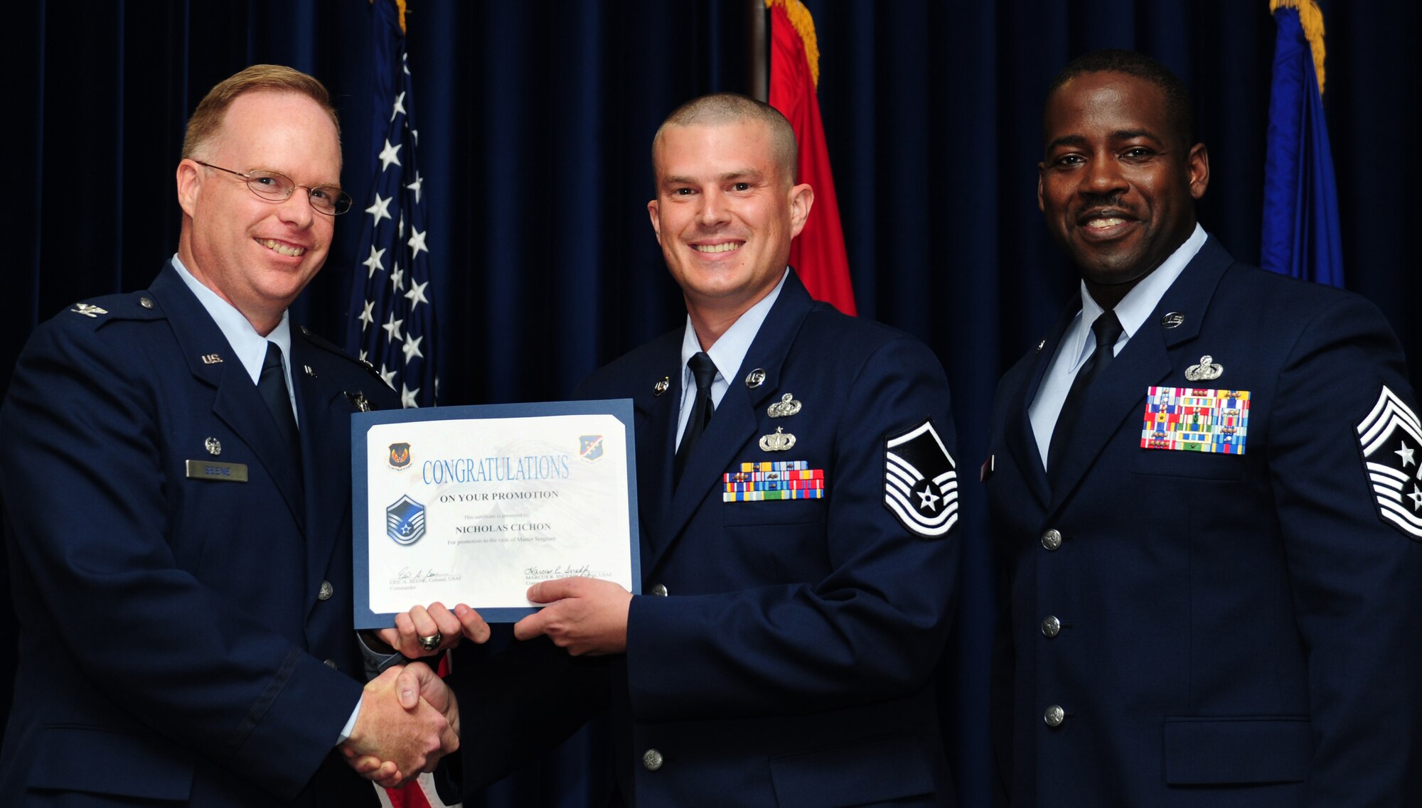Nicholas Cichon, 39th Communications Squadron, is promoted to the rank of master sergeant June 30, 2011, at the Club Complex Ballroom at Incirlik Air Base, Turkey. (U.S. Air Force photo by Senior Airman Anthony Sanchelli/Released)