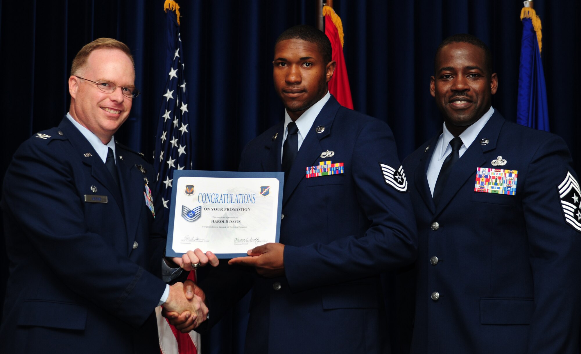 Harold Davis, 728th Air Mobility Squadron, is promoted to the rank of technical sergeant June 30, 2011, at the Club Complex Ballroom at Incirlik Air Base, Turkey. (U.S. Air Force photo by Senior Airman Anthony Sanchelli/Released)