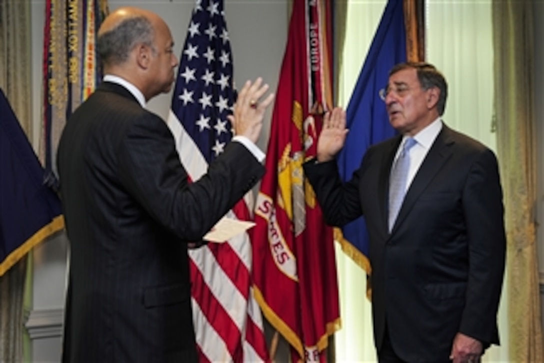 Leon E. Panetta takes the oath of office as the 23rd Secretary of Defense during a Pentagon ceremony on July 1, 2011.  Department of Defense General Counsel Jeh Johnson administered the oath in the secretary's office.  