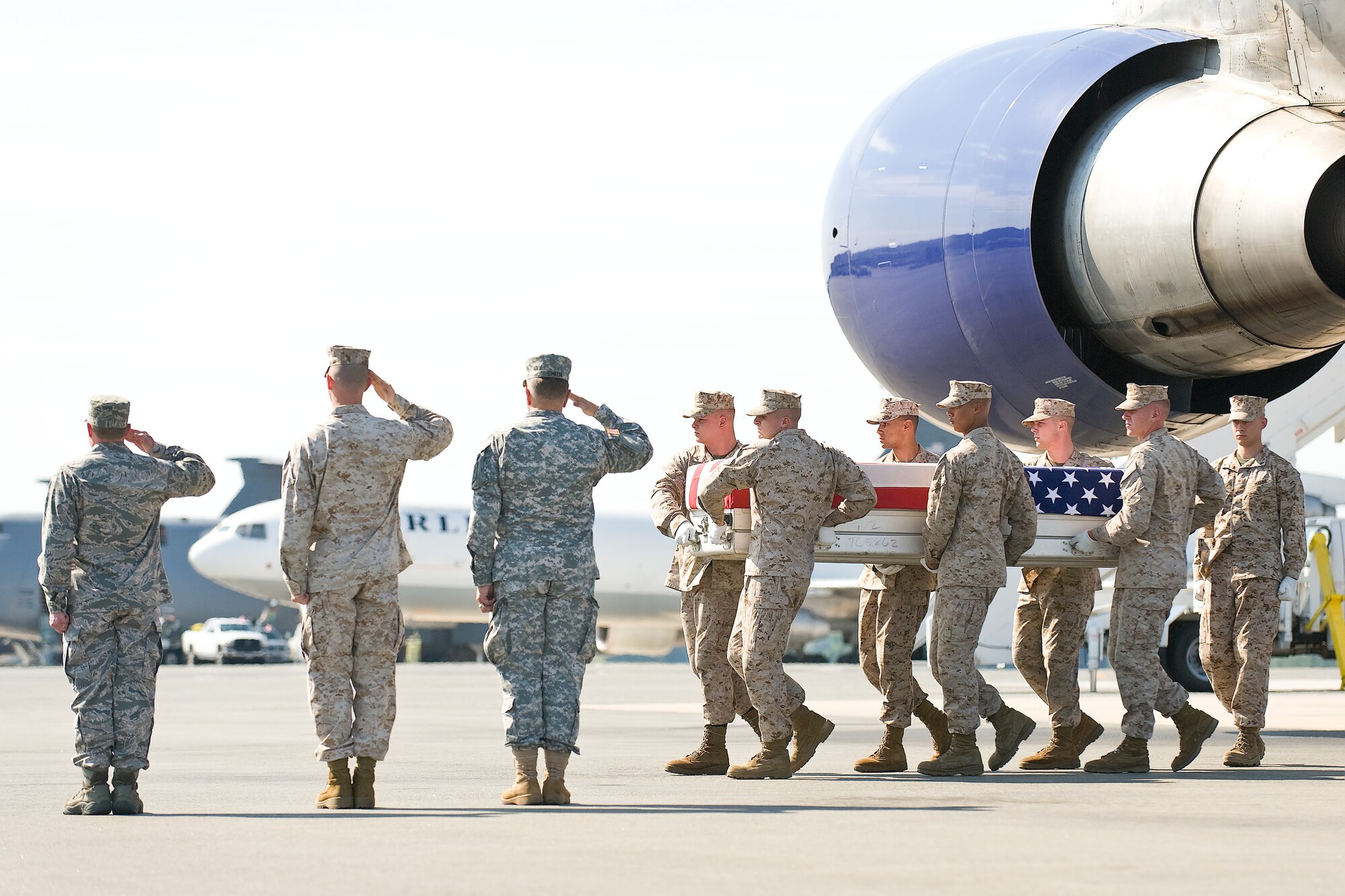A U.S. Marine Corps carry team transfers the remains of Marine Cpl. Kyle R. Schneider, of Phoenix, N.Y., at Dover Air Force Base, Del., July 2, 2011. Schneider was assigned to the 2nd Battalion, 8th Marine Regiment, 2nd Marine Division, II Marine Expeditionary Force, Camp Lejeune, N.C. (U.S. Air Force photo/Roland Balik)