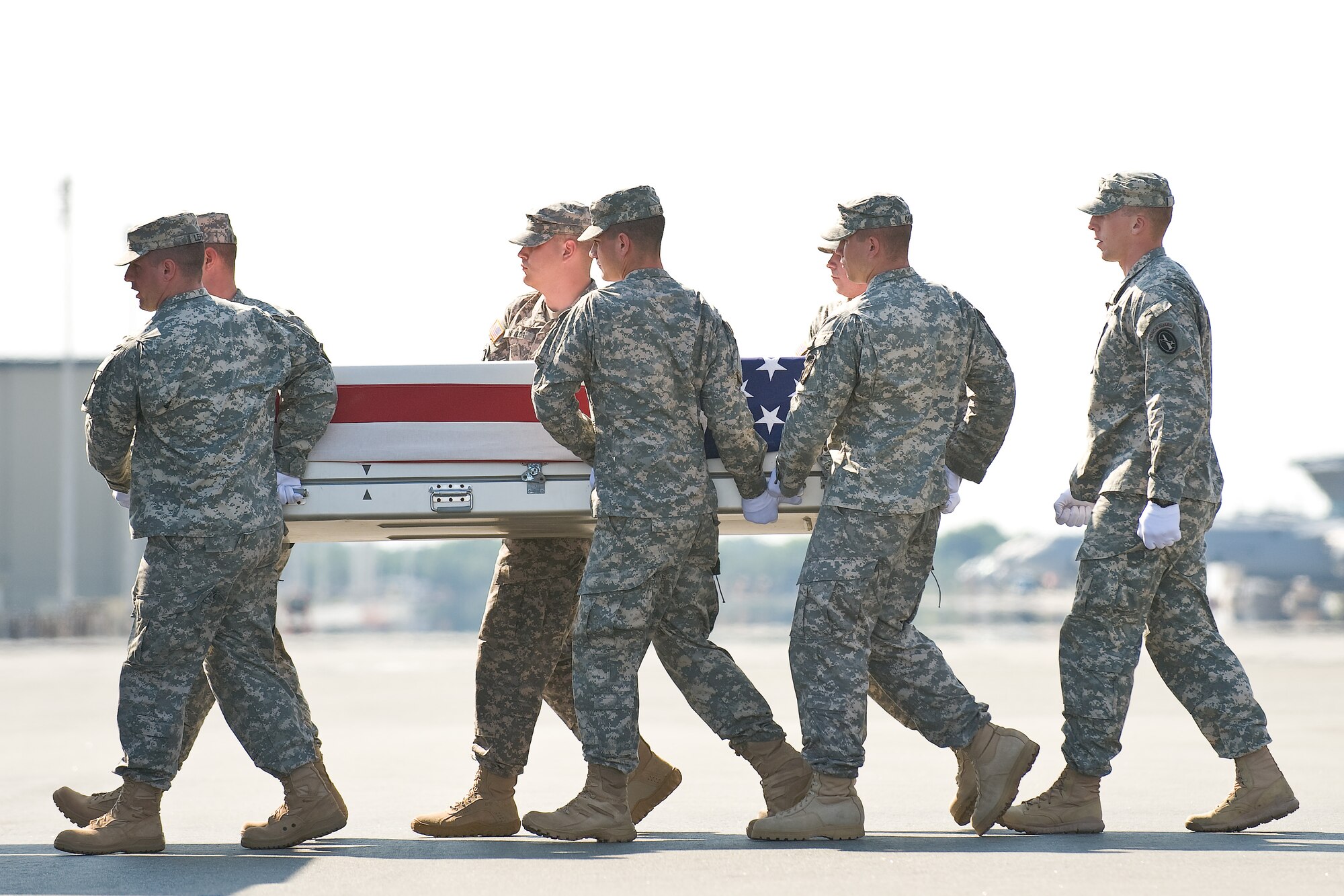 A U.S. Army carry team transfers the remains of Army Pfc. James A. Waters, of Cloverdale, Ind., at Dover Air Force Base, Del., July 2, 2011. Waters was assigned to the 1st Battalion, 32nd Infantry Regiment, 3rd Brigade Combat Team, Fort Drum, N.Y. (U.S. Air Force photo/Roland Balik)