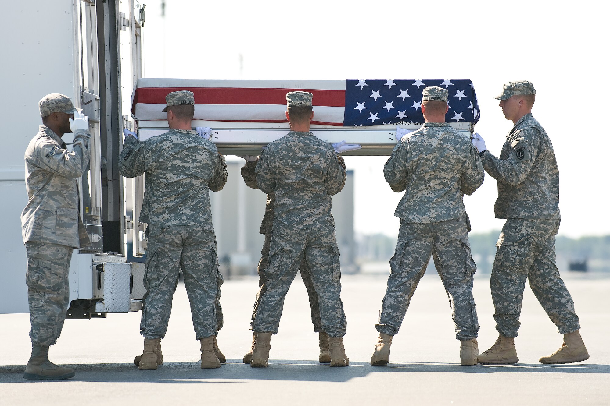 A U.S. Army carry team transfers the remains of Army Capt. Matthew G. Nielson, of Jefferson, Iowa, at Dover Air Force Base, Del., July 2, 2011. Nielson was assigned to the 2nd Squadron, 3rd Armored Cavalry Regiment, Fort Hood, Texas. (U.S. Air Force photo/Roland Balik)

