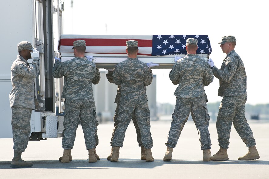 A U.S. Army carry team transfers the remains of Army Capt. Matthew G. Nielson, of Jefferson, Iowa, at Dover Air Force Base, Del., July 2, 2011. Nielson was assigned to the 2nd Squadron, 3rd Armored Cavalry Regiment, Fort Hood, Texas. (U.S. Air Force photo/Roland Balik)