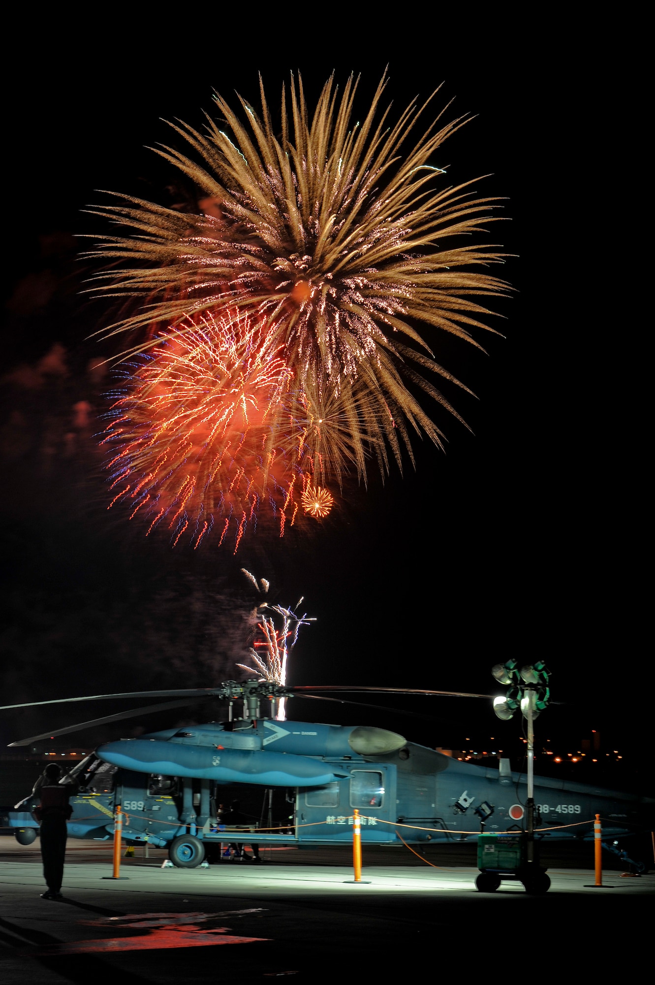 Fireworks fire off ending AmericaFest July 2.  AmericaFest is a chance to celebrate Independence Day and share the celebration with our Japanese counterparts. Food, games and musical entertainment were also provided. (U.S.  Air Force Photo/Staff Sgt. Jonathan Steffen)