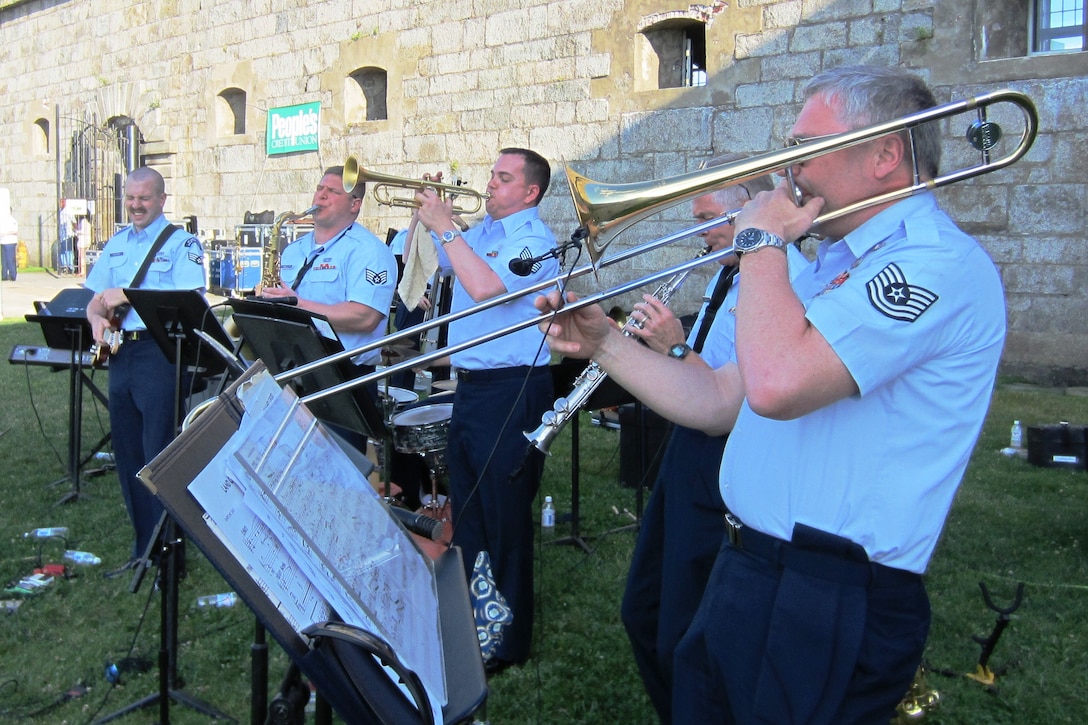 Newport, RI:  The Protocol Combo performs for a packed lawn at Ft Adams State Park in Newport, Rhode Island.  Pictured (l-r) are SrA Kevin Klepacki on guitar, SSgt Chris Langellotti on tenor saxophone, SSgt Matt Leder (visiting from the ANG Band of the Northwest in WA), SSgt Steve Dickerson on soprano saxophone, and TSgt Ed Stromski on trombone.  