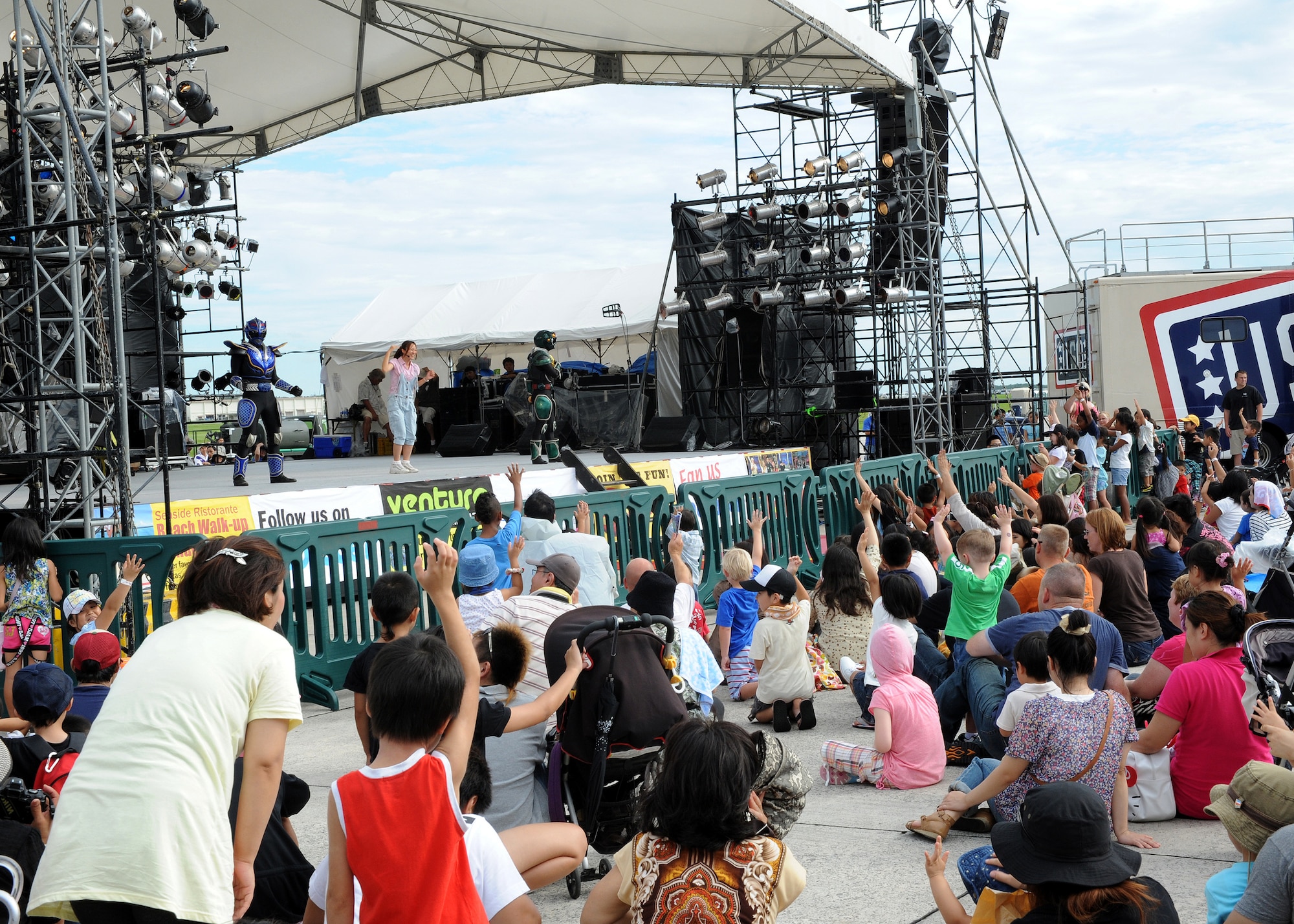 Ryujin Mabuyer, popular Japanese action heroes, perform for an American and Japanese audience during AmericaFest 2011 at Kadena Air Base, July 2. AmericaFest was an Independence Day celebration open to the local community. Static Japanese and U.S. military aircraft, food, games, and live entertainment were some of the attractions during the two-day event. (U.S. Air Force photo/Junko Kinjo)