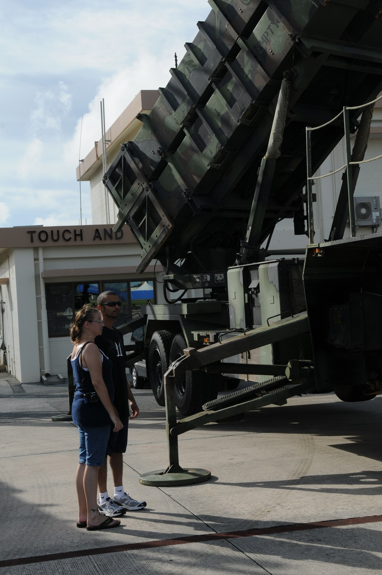 Staff Sgt. Rolando Clavell, 18th Component Maintenance Squadron electrician, and his wife, Diana, check out the Army Patriot July 1 during AmericaFest at Kadena Air Base, Japan. AmericaFest took place on the Kadena flight line July 1 and 2. (U.S. Air Force photo/Staff Sgt. Amanda Savannah)
