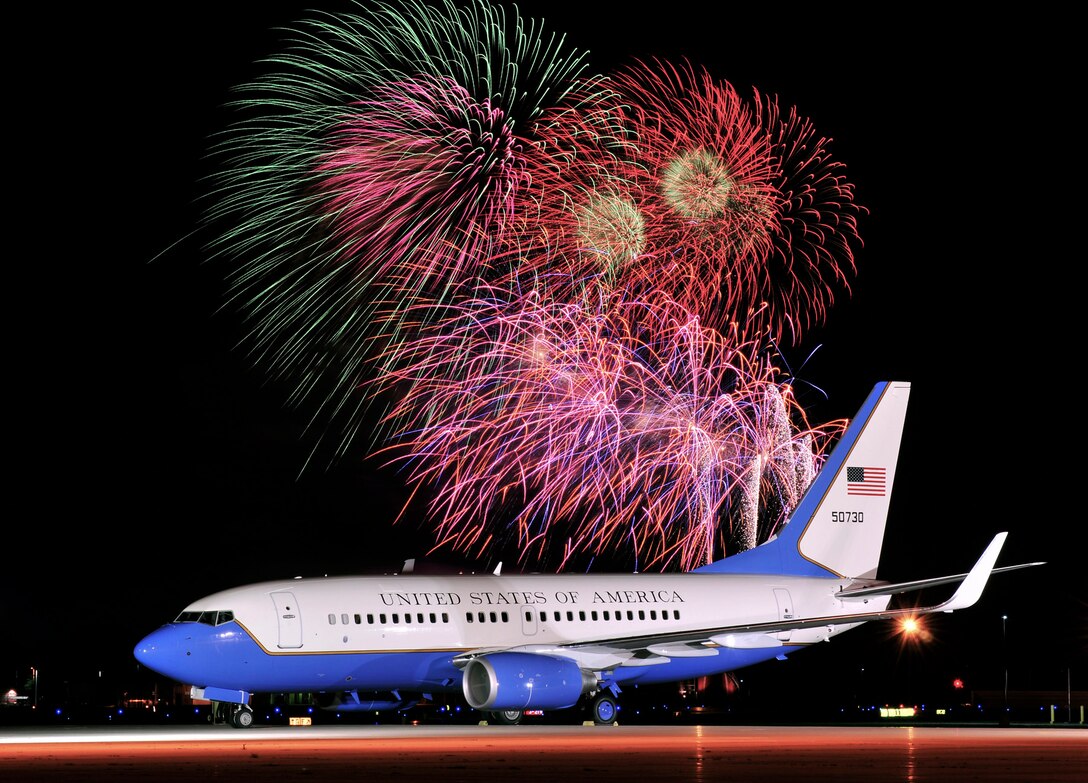 A U.S. Air Force Reserve Command C-40C aircraft of the 932nd Airlift Wing is captured at Madison, Wisconsin on the transient ramp of the 115th Fighter Wing, Wisconsin Air National Guard. Two miles distant is Rhythm & Booms 2011, the largest fireworks display in the Midwest. Rhythm and Booms is a day-long celebration of American independence and patriotism. The July 2 event drew over 230,000 spectators, and included an F-16 formation flyover at dusk, Wisconsin Army National Guard demos, and day and nighttime jumps by the U.S. Army's Golden Knights parachute team. (U.S. Air Force Reserve Command photo submitted by Joe Oliva)