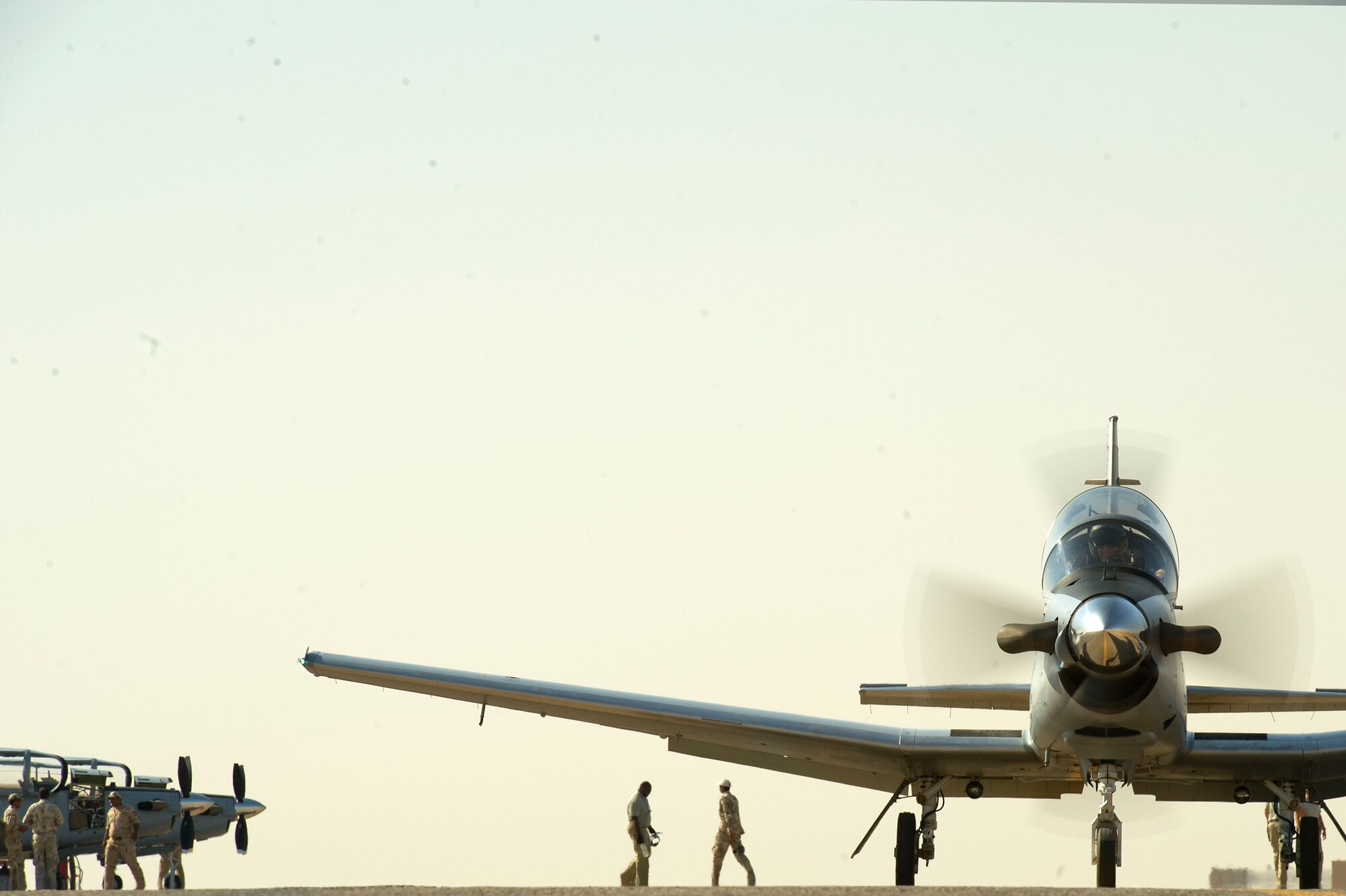 An Iraqi pilot instructor student taxis his T-6 Texan out to the runway at Combat Operating Base Speicher, Tikrit, Iraq on June 29, 2011. Students graduating the course become some of the first U.S. Air Force trained Iraqi instructor pilots. The T-6 is the primary training aircraft of the unit. (U.S. Air Force photo by Staff Sergeant David Salanitri/Released)