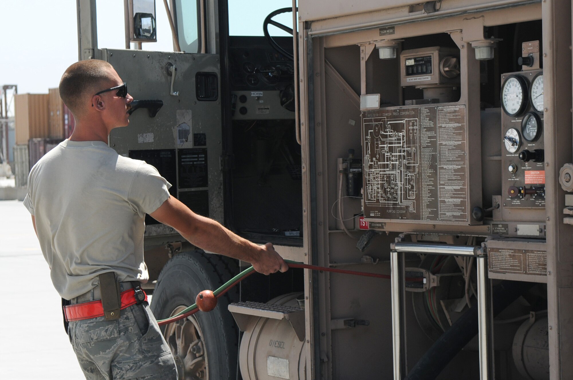 BAGRAM AIRFIELD, Afghanistan -- Airman 1st Class Kailyne Jones,  455th Expeditionary Logistics Readiness Squadron, fuels distribution operator,  fuels a MC-12 Liberty aircraft here July 2. Airman Jones arrived here in February and rapidly established himself as a top performer, helping to safely issue 48 million gallons of fuel to more than 15,000 coalition aircraft. The hard-charging Airman has set numerous fuels records during his time here. To date, he has personally pumped more than 3 million gallons of fuel on more than 2,000 fuel runs, with an average response time of 10 minutes. (U.S. Air Force photo by Senior Airman Krista Rose.)