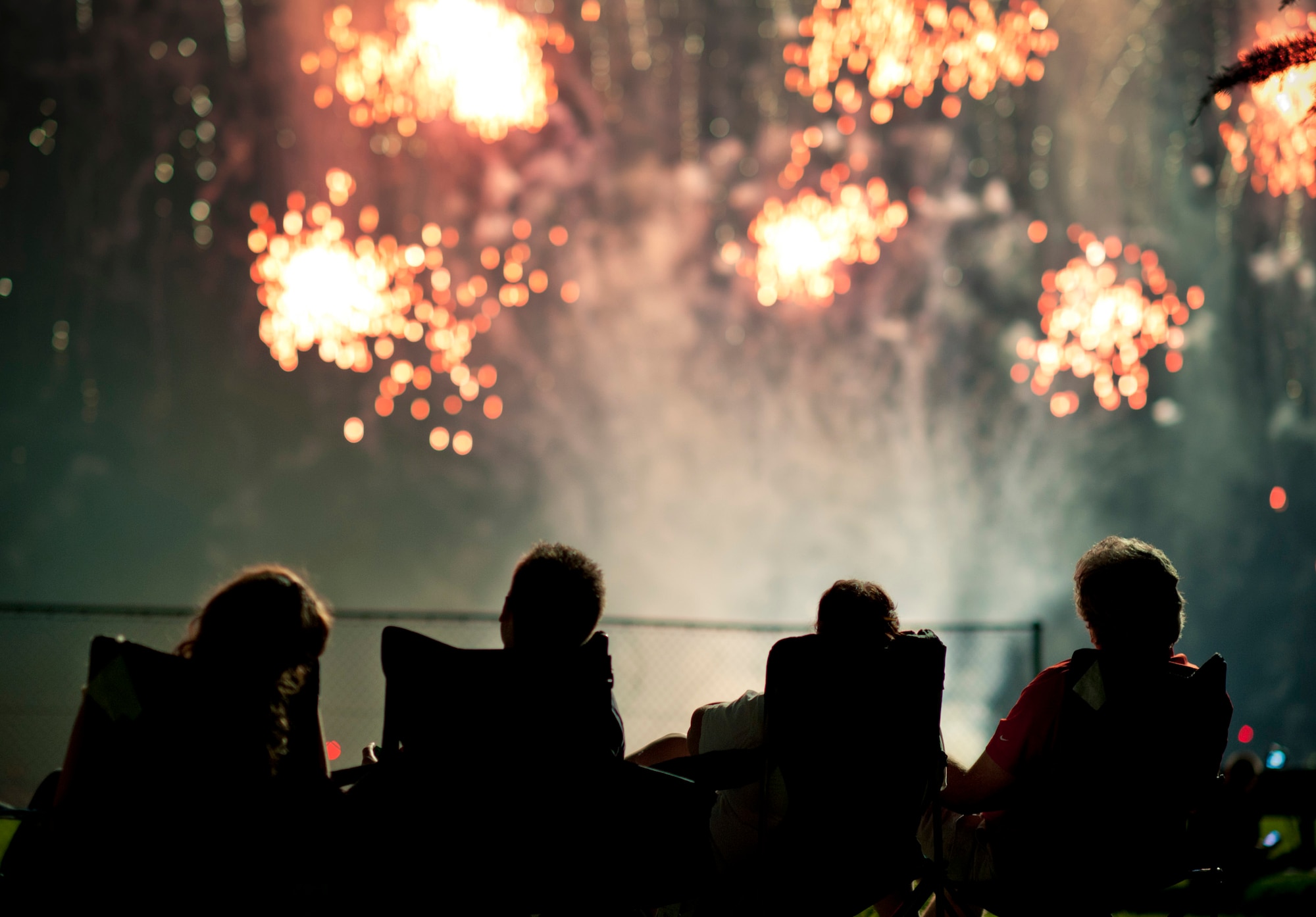 YOKOTA AIR BASE, Japan -- Spectators watch a fireworks display at the end of the 374th Force Support Squadron Celebrate America festival July 2, 2011, at Yokota Air Base, Japan. The annual festival gives Yokota residents a taste of home in honor of Independence Day. (U.S. Air Force photo/Staff Sgt. Samuel Morse)