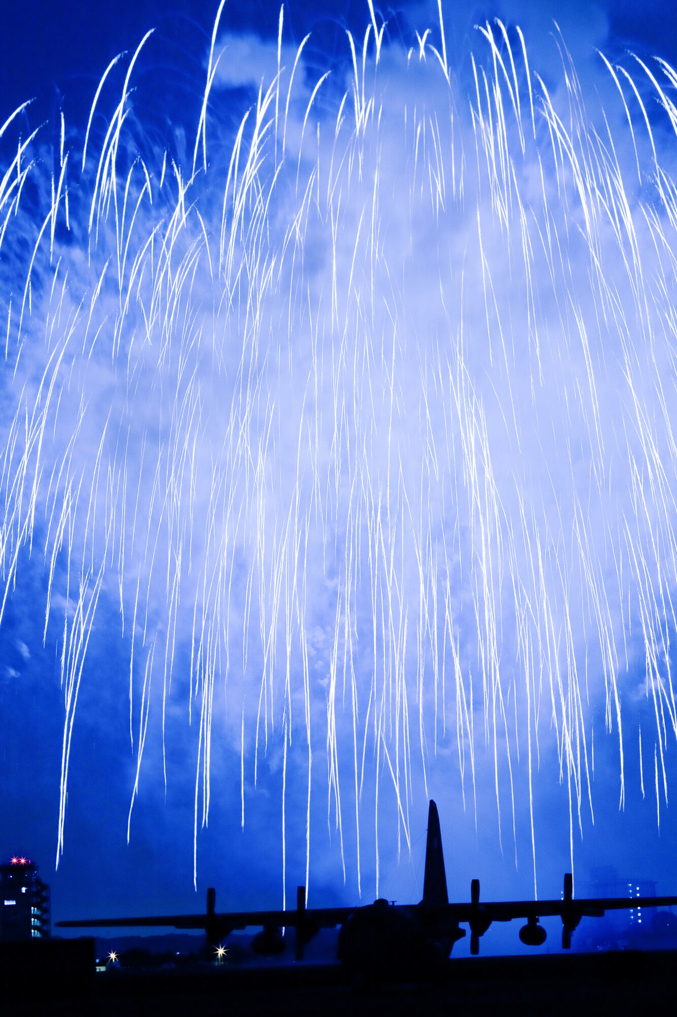 YOKOTA AIR BASE, Japan -- Fireworks burst over Yokota Air Base, Japan, July 2, 2011. The 374th Force Support Squadron provided Yokota residents and their guests with events for all ages. The day kicked off with the firecracker 5K run and a wide variety of activities throughout the day to include go-carts, a petting zoo, live entertainment, food and fireworks. (U.S. Air Force photo/Osakabe Yasuo)