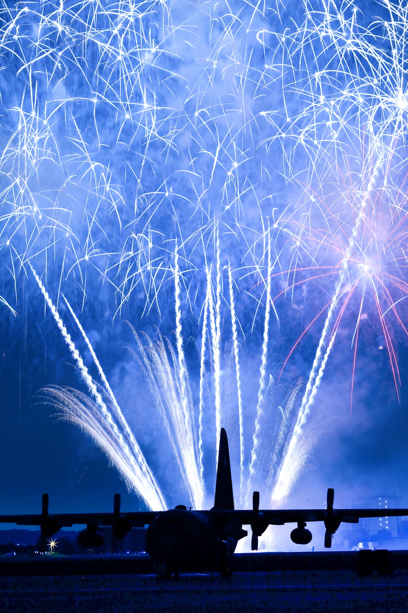 YOKOTA AIR BASE, Japan -- Fireworks burst over Yokota Air Base, Japan, July 2, 2011. The 374th Force Support Squadron provided Yokota residents and their guests with events for all ages. The day kicked off with the firecracker 5K run and a wide variety of activities throughout the day to include go-carts, a petting zoo, live entertainment, food and fireworks. (U.S. Air Force photo/Osakabe Yasuo)