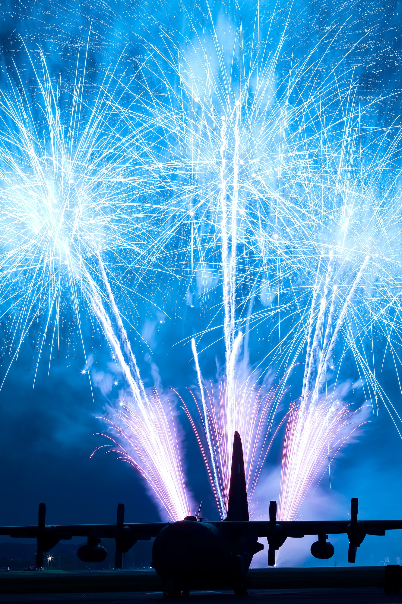 YOKOTA AIR BASE, Japan -- Fireworks burst over Yokota Air Base, Japan, July 2, 2011. The 374th Force Support Squadron provided Yokota residents and their guests with events for all ages. The day kicked off with the firecracker 5K run and a wide variety of activities throughout the day to include go-carts, a petting zoo, live entertainment, food and fireworks. (U.S. Air Force photo/Osakabe Yasuo)