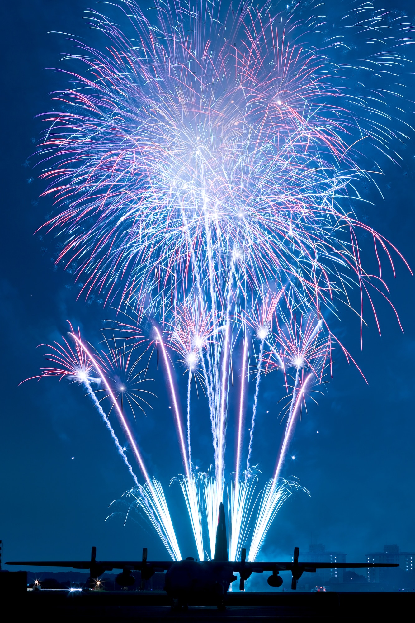 YOKOTA AIR BASE, Japan -- Fireworks burst over Yokota Air Base, Japan, July 2, 2011. The 374th Force Support Squadron provided Yokota residents and their guests with events for all ages. The day kicked off with the firecracker 5K run and a wide variety of activities throughout the day to include go-carts, a petting zoo, live entertainment, food and fireworks. (U.S. Air Force photo/Osakabe Yasuo)
