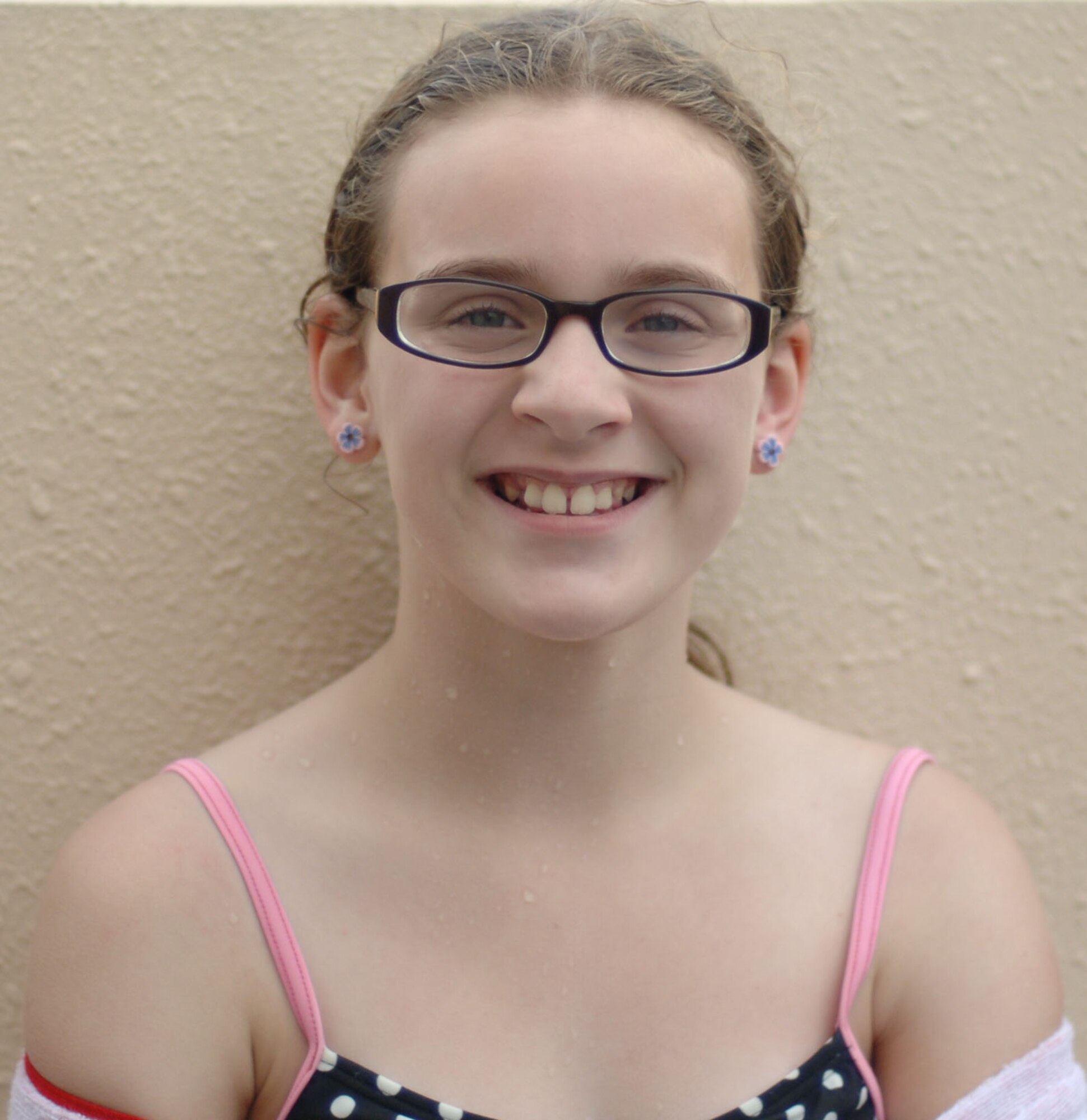 Maevin Voigt, daughter of Capt. Jeremy Voigt, poses for a picture at Sakana Pool, Yokota Air Base, Japan, June 29, 2011. For her summer vacation, Maevin says, "I plan on hanging out with friends and going on bike rides." (U.S. Air Force photo/ Airman 1st Class Lynsie Nichols)
