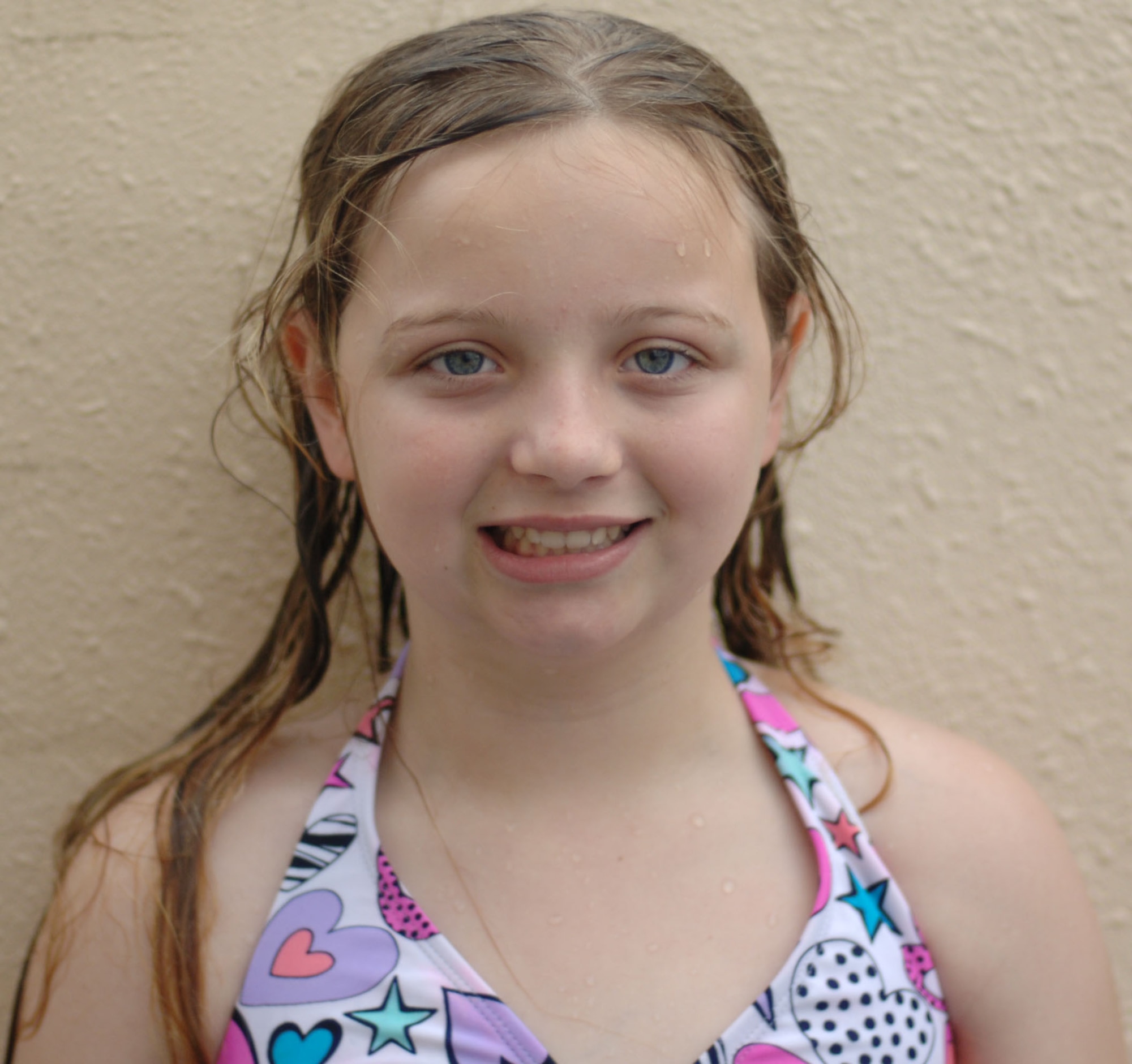 Tatum Michael, daughter of Staff Sgt. Charles Michael, poses for a picture at the Sakana Pool, Yokota Air Base, Japan, June 29, 2011. For her summer vacation, Tatum says, "I plan on hanging out with my friends." (U.S. Air Force photo/ Airman 1st Class Lynsie Nichols)