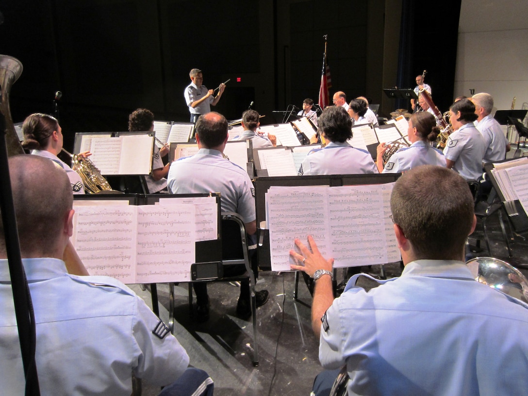 Sandy Hook, CT: 2Lt Steven Ortiz conducts the band during a free public concert at Sandy Hook High School.  The band is conducting a summer concert tour through the southern tier of their Area of Responsibility, performing in NY, CT, RI, and MA.